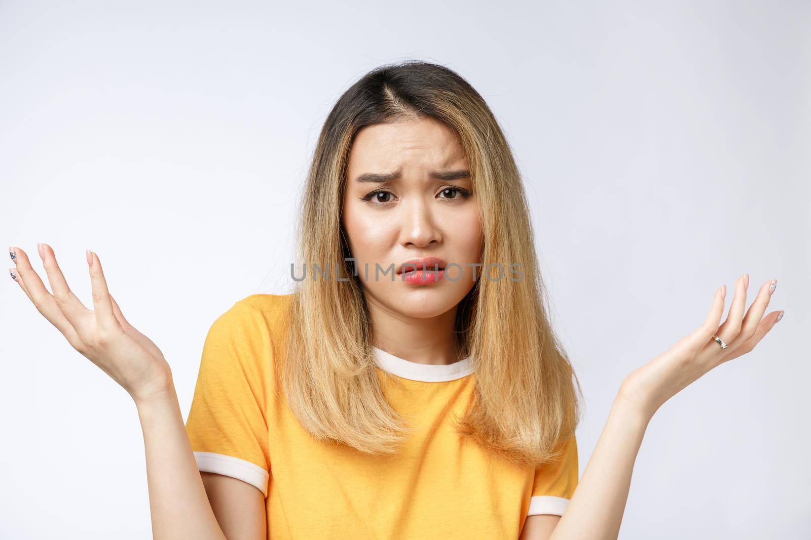 Portrait of sad crying pensive mad crazy asian woman. Closeup young asian woman isolated on white background. by Benzoix