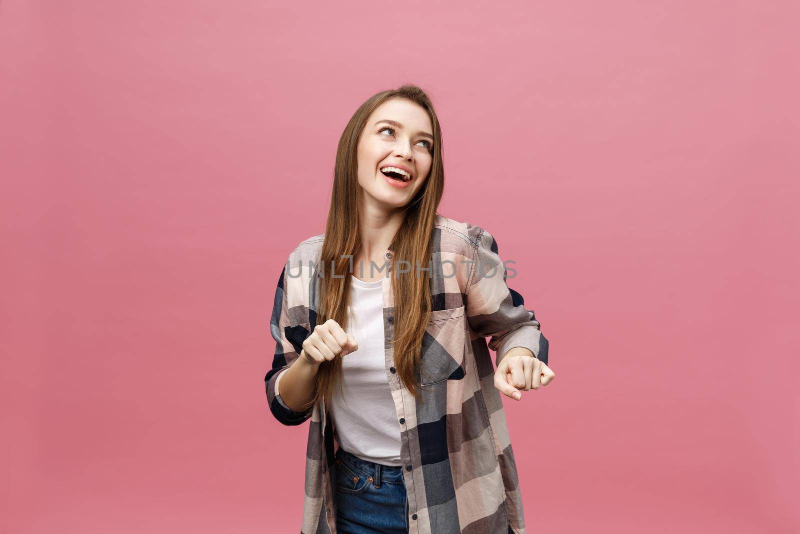 Portrait young girl dancing with inspired face expression. Active young woman in casual summer outfit having fun indoor