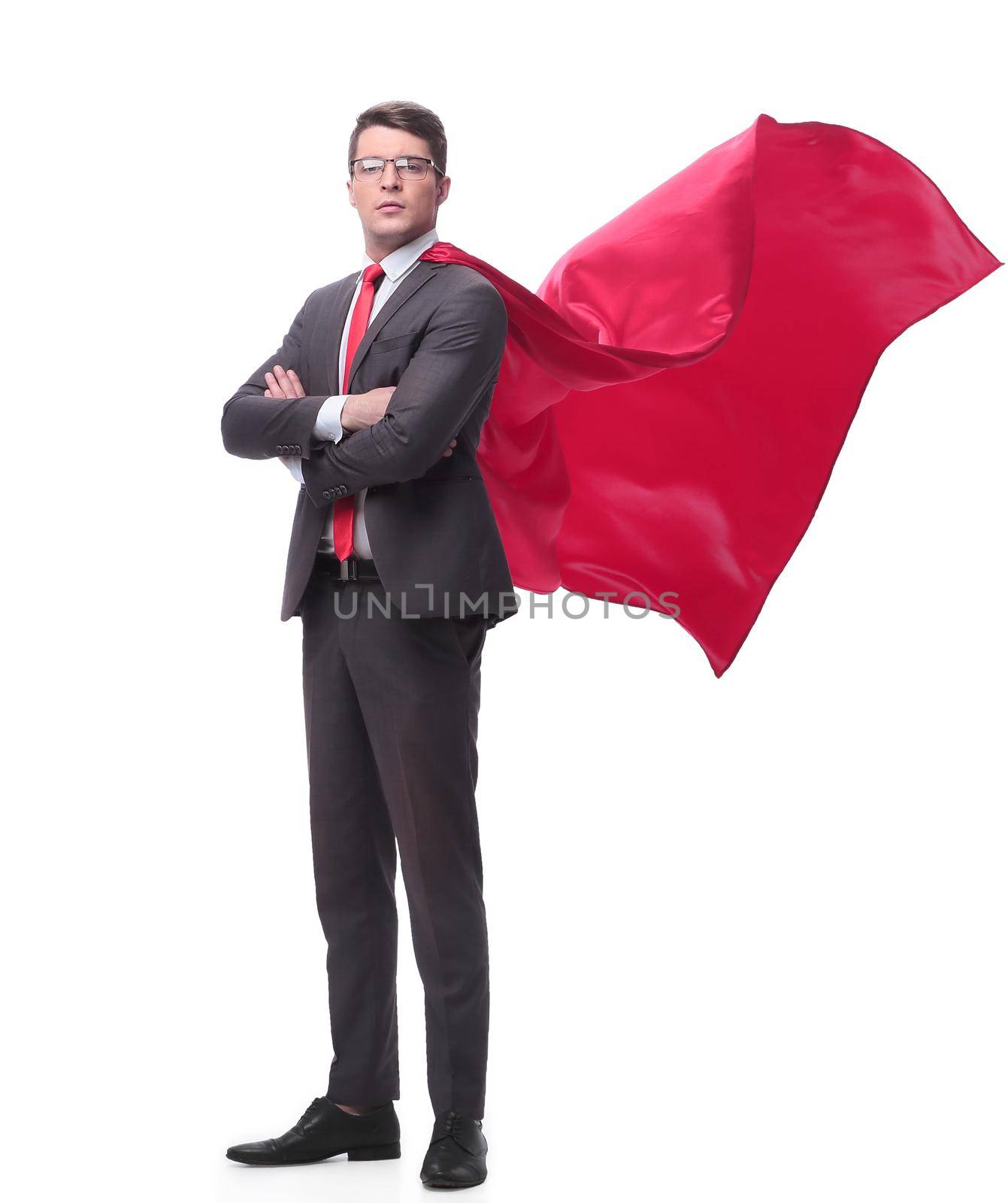 full length . confident businessman superhero in a red Cape. isolated on white