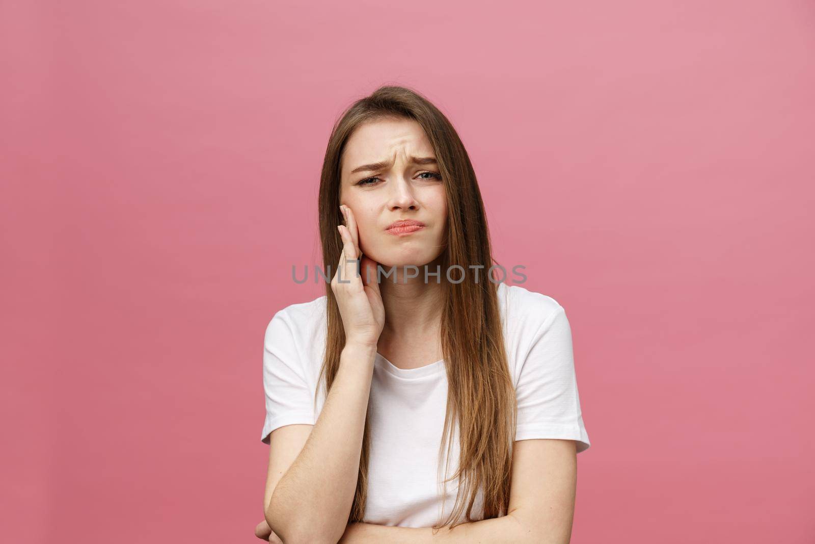 Young caucasian woman over isolated background touching mouth with hand with painful expression because of toothache. Dentist concept.