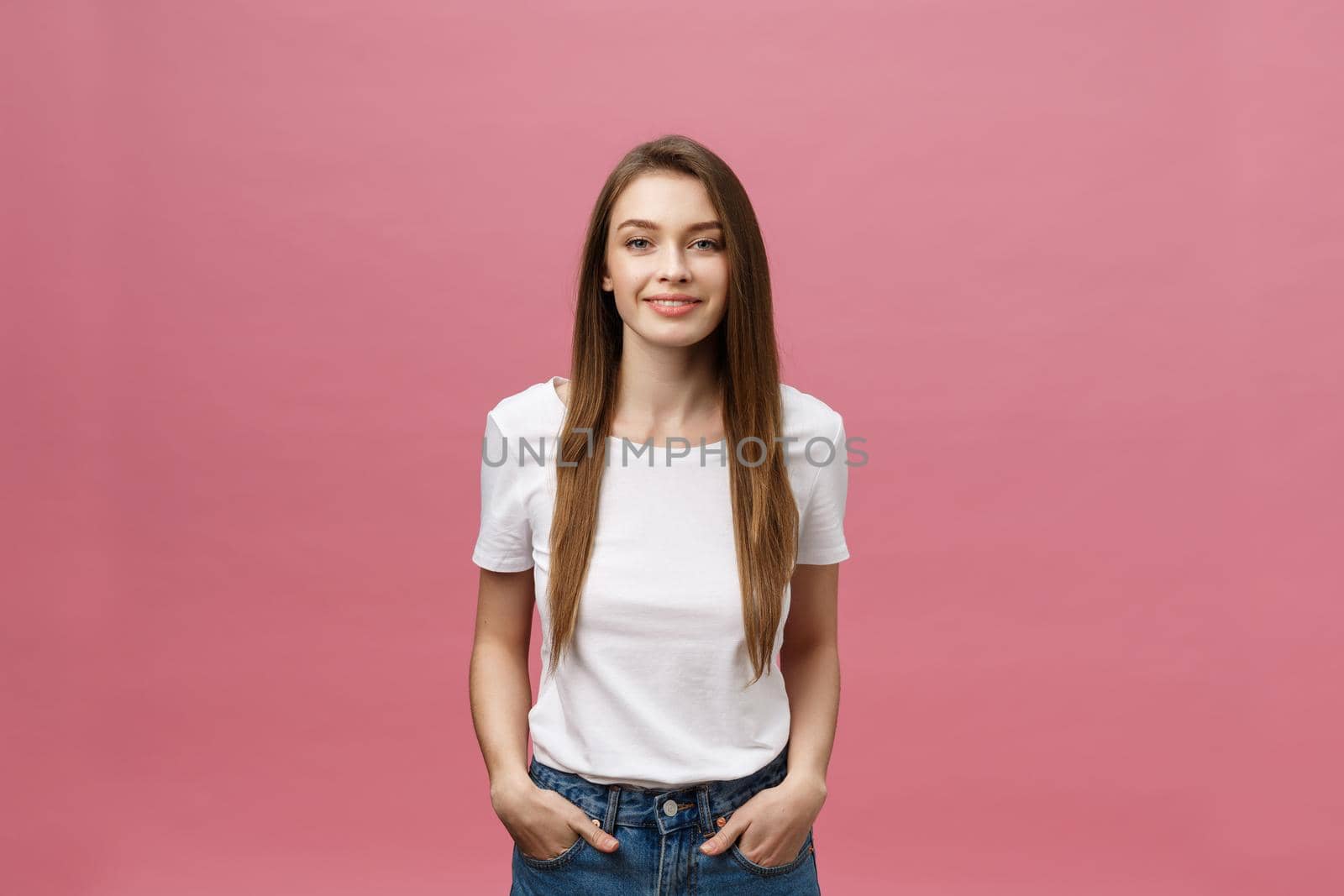 Surprised happy beautiful woman looking in excitement. Isolate over pink background and copy space