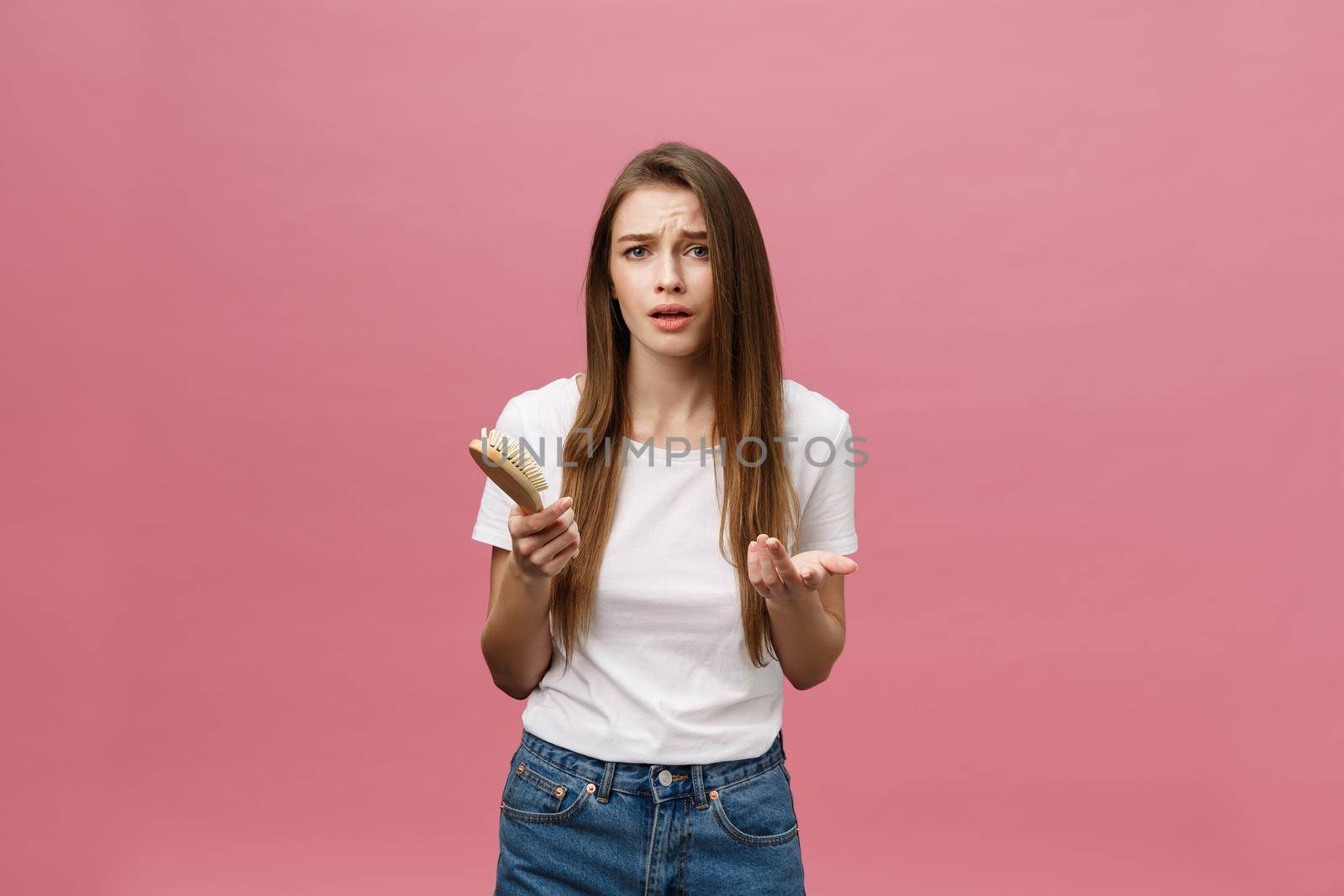 girl on a pink background with a comb for the hair, the hair problem by Benzoix