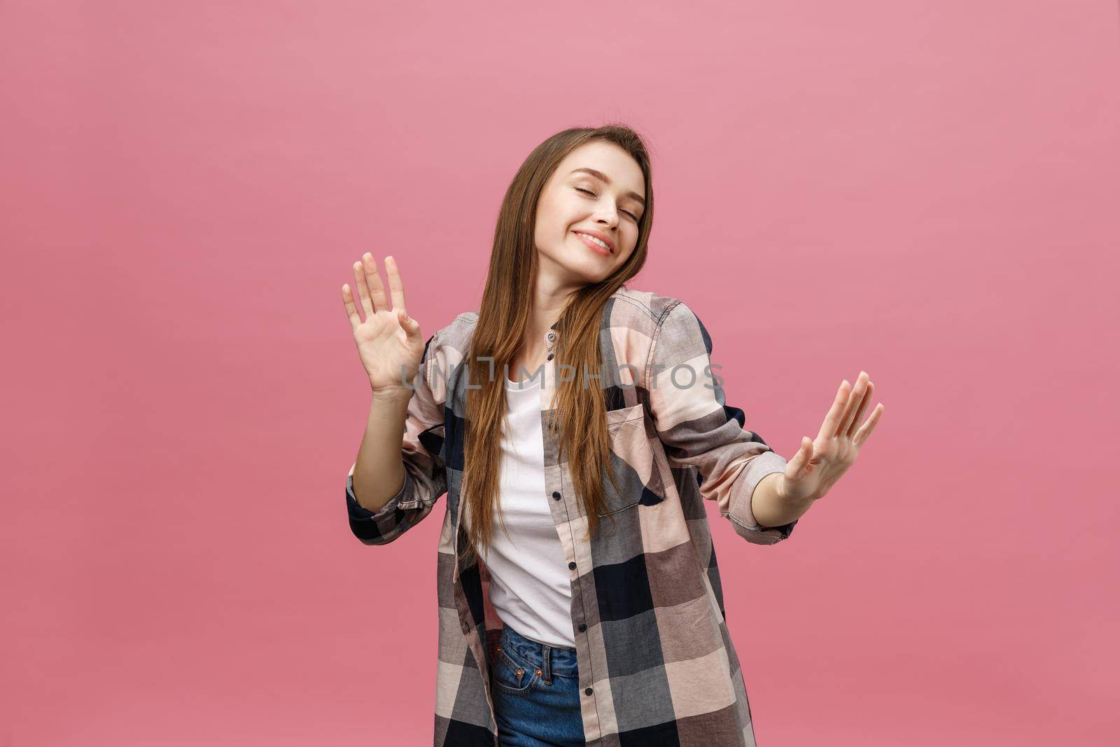 Portrait young girl dancing with inspired face expression. Active young woman in casual summer outfit having fun indoor. by Benzoix