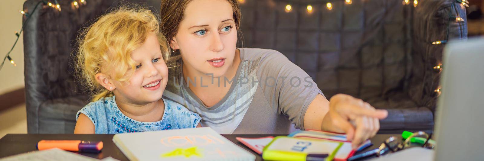 A teacher, a tutor for home schooling and a teacher at the table. Or mom and daughter. Homeschooling BANNER, LONG FORMAT by galitskaya