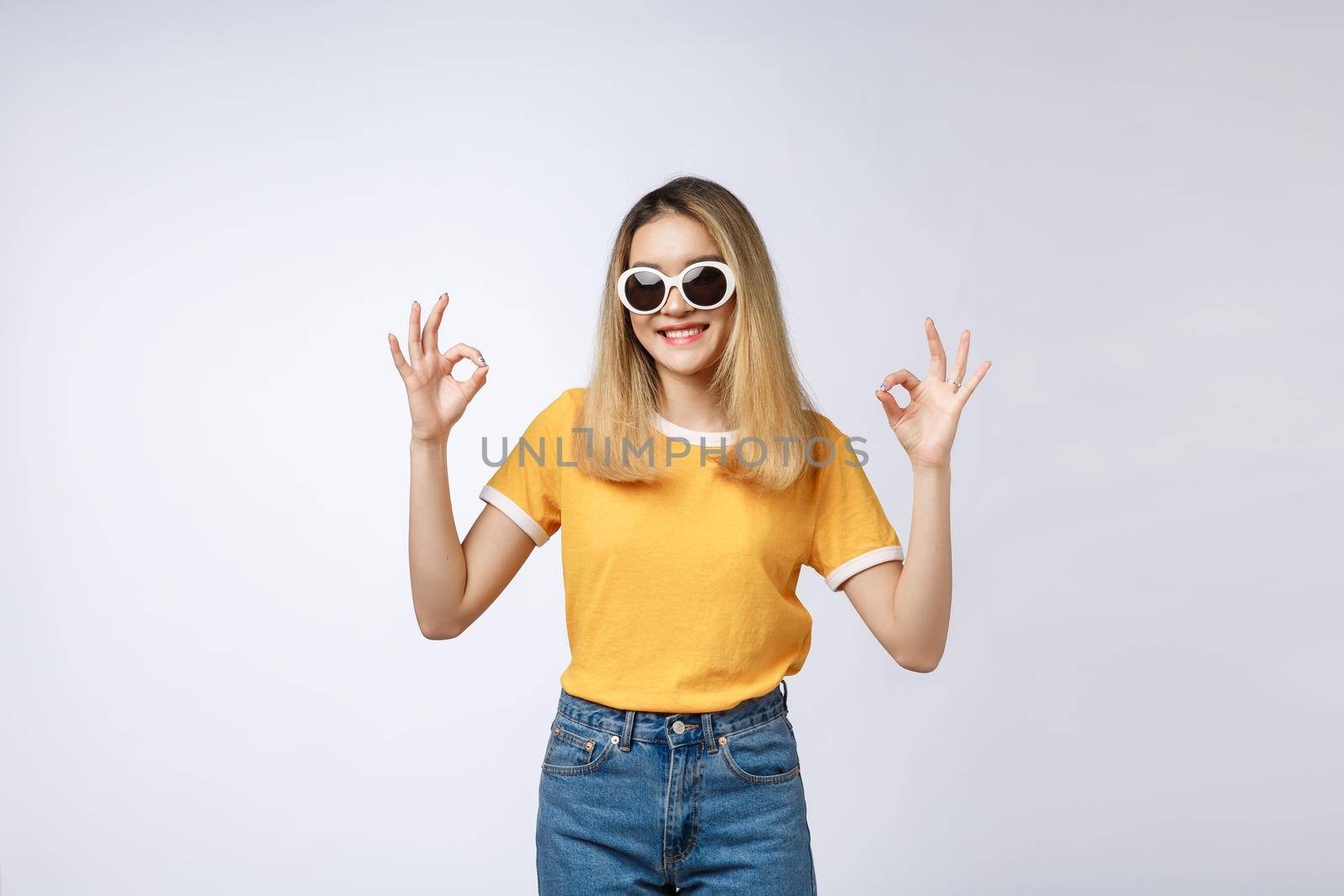 Asian young woman beautiful smile with ok finger sign isolate on white background.