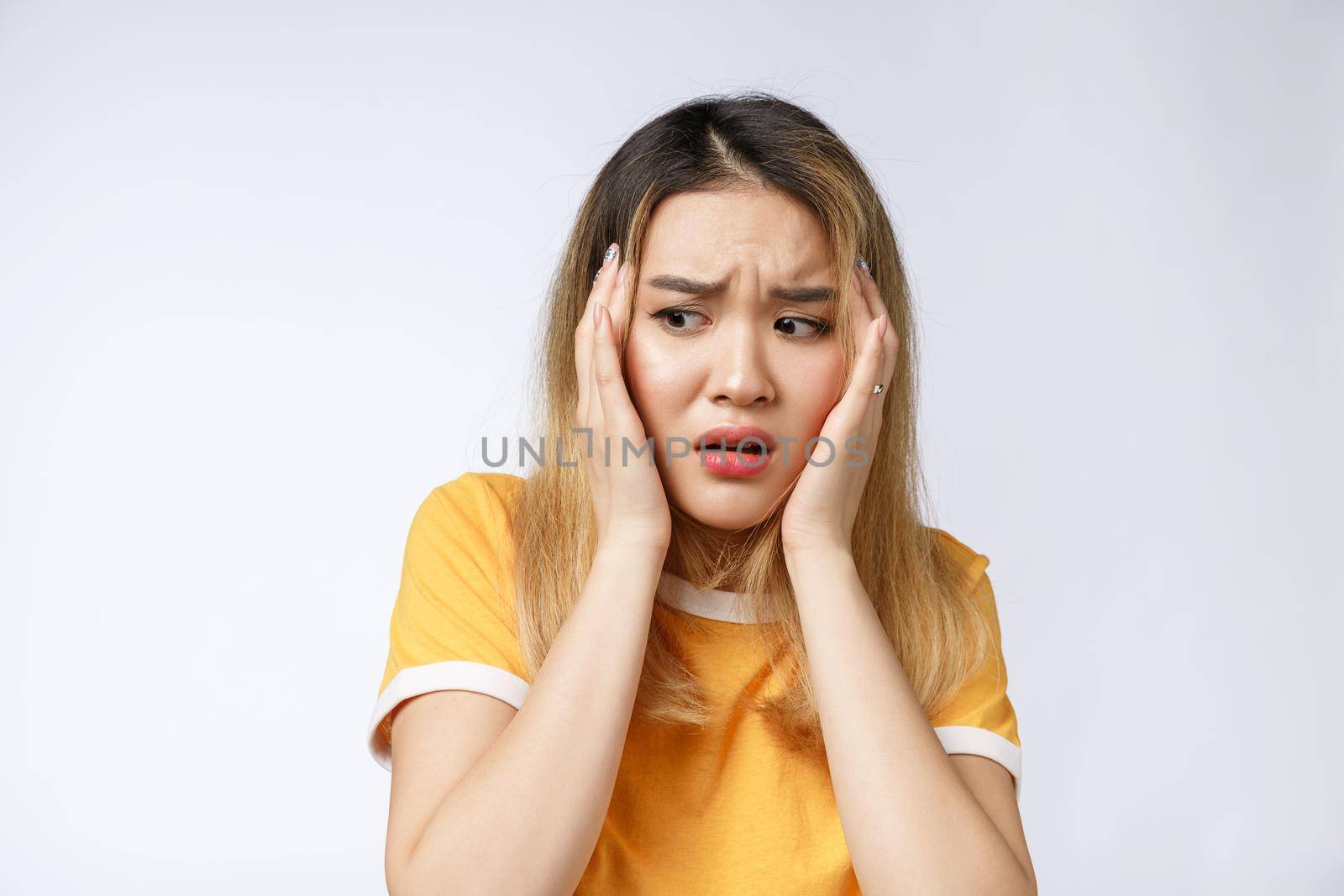 Portrait of sad crying pensive mad crazy asian woman. Closeup young asian woman isolated on white background