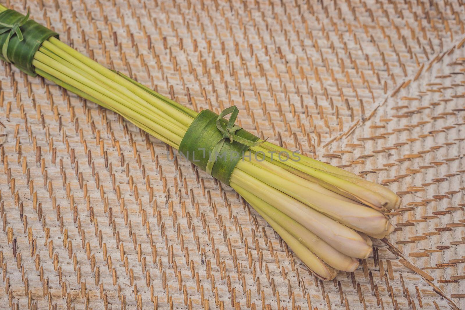 Eco-friendly product packaging concept. Lemongrass wrapped in a banana leaf, as an alternative to a plastic bag. Zero waste concept. Alternative packaging.