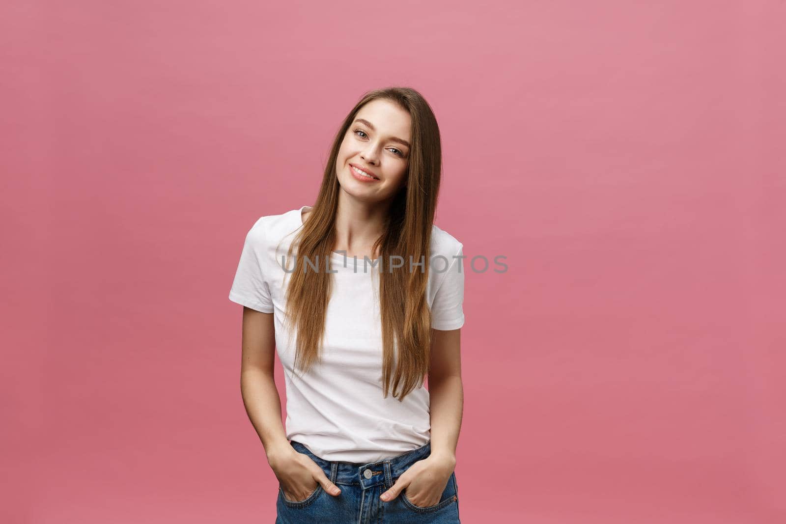 Surprised happy beautiful woman looking in excitement. Isolate over pink background and copy space. by Benzoix