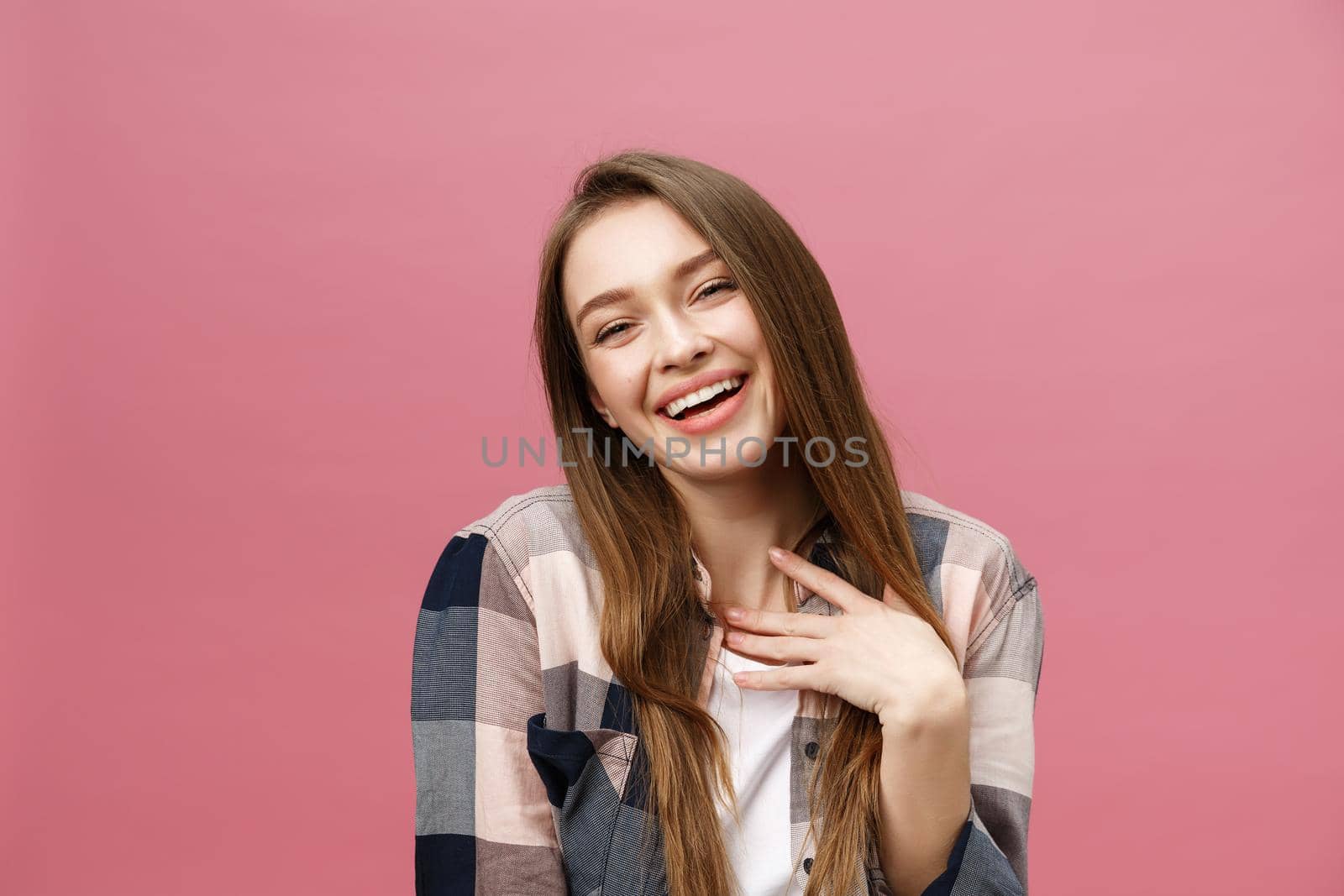 Portrait of beautiful brunette caucasian woman in pink studio by Benzoix