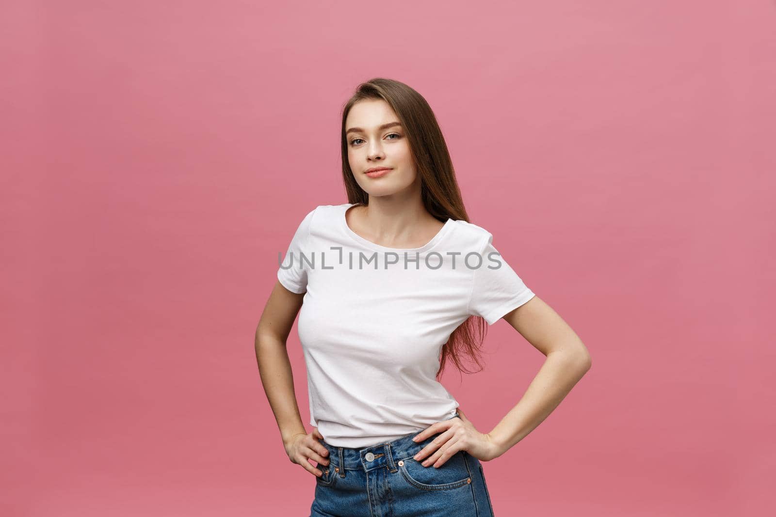 Surprised happy beautiful woman looking in excitement. Isolate over pink background and copy space
