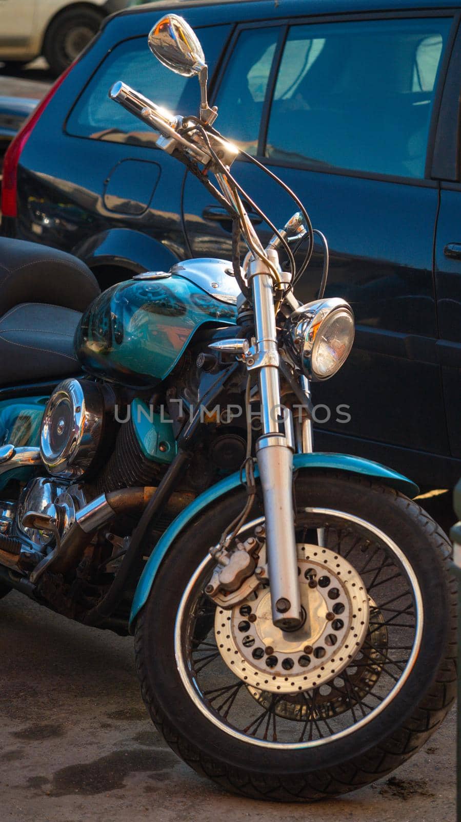 metallic blue motorbike, Parked in town