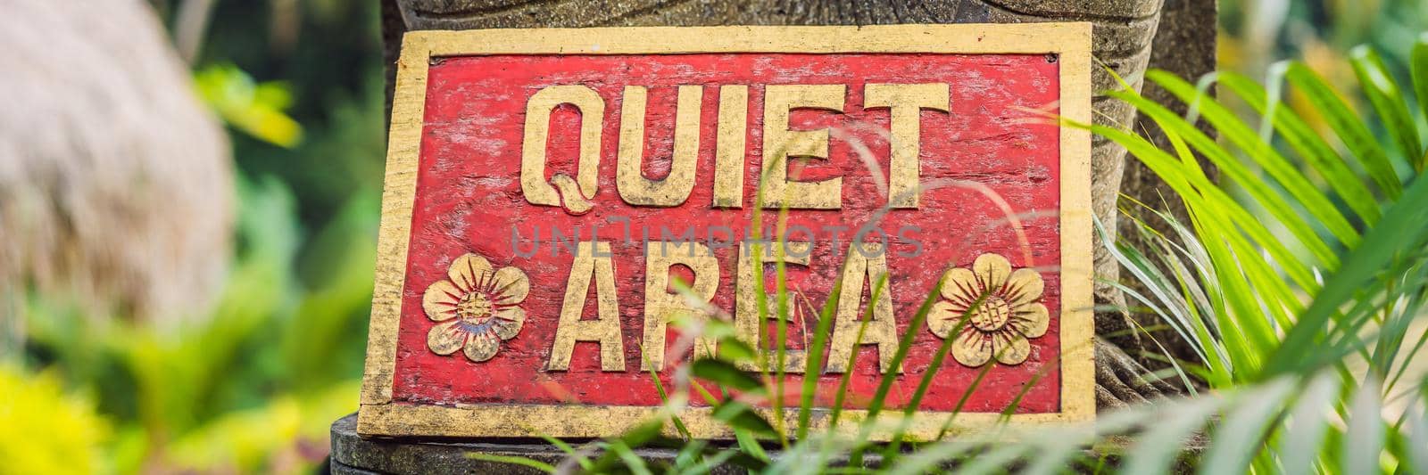 A sign QUIET AREA in a quiet corner of the garden. BANNER, LONG FORMAT