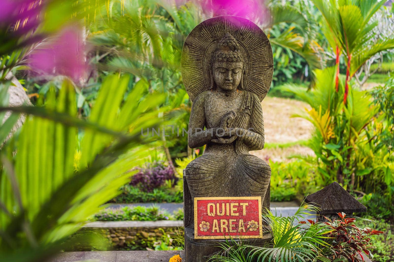 A sign QUIET AREA in a quiet corner of the garden.