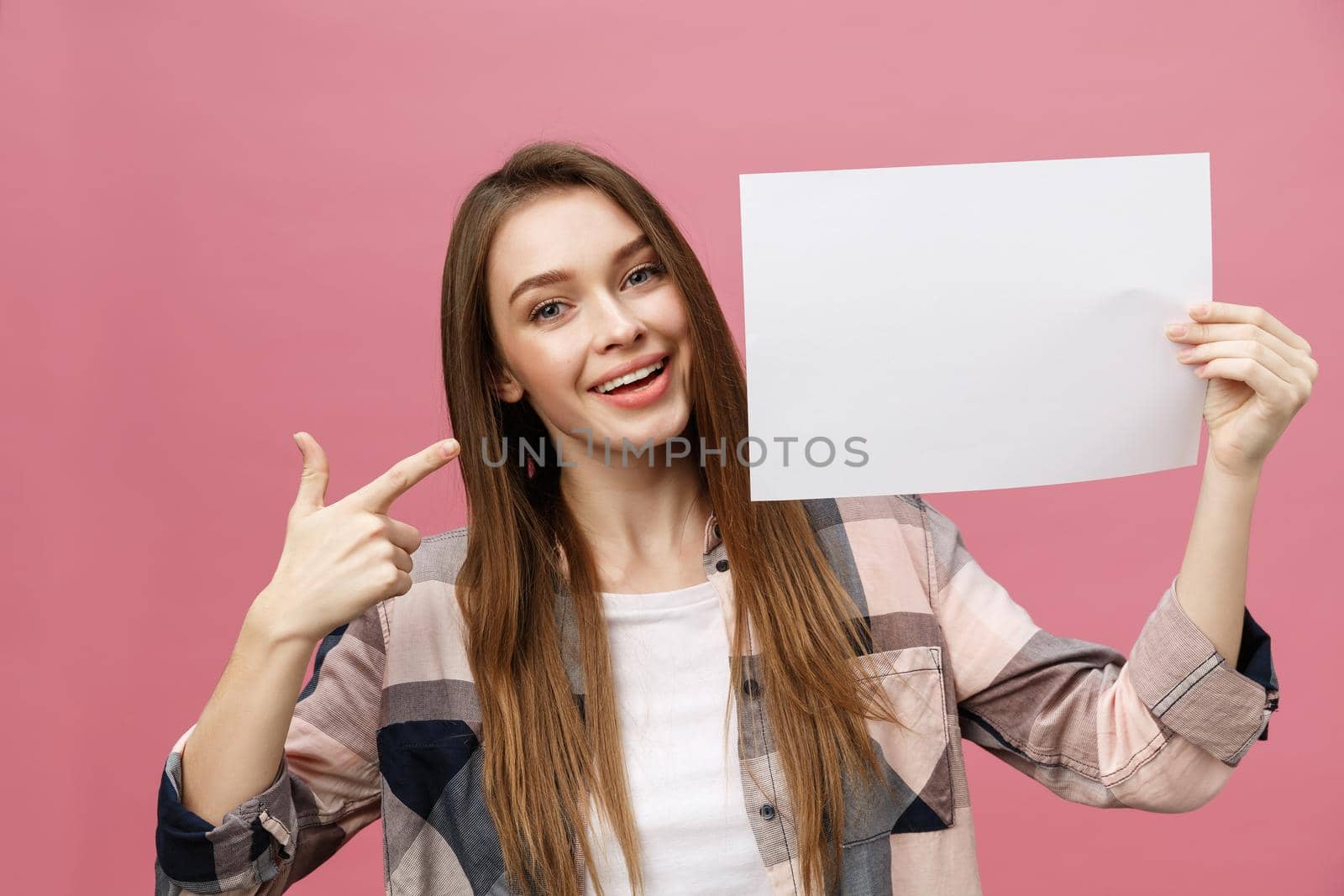 young smile woman standing pointing her finger at a blank board