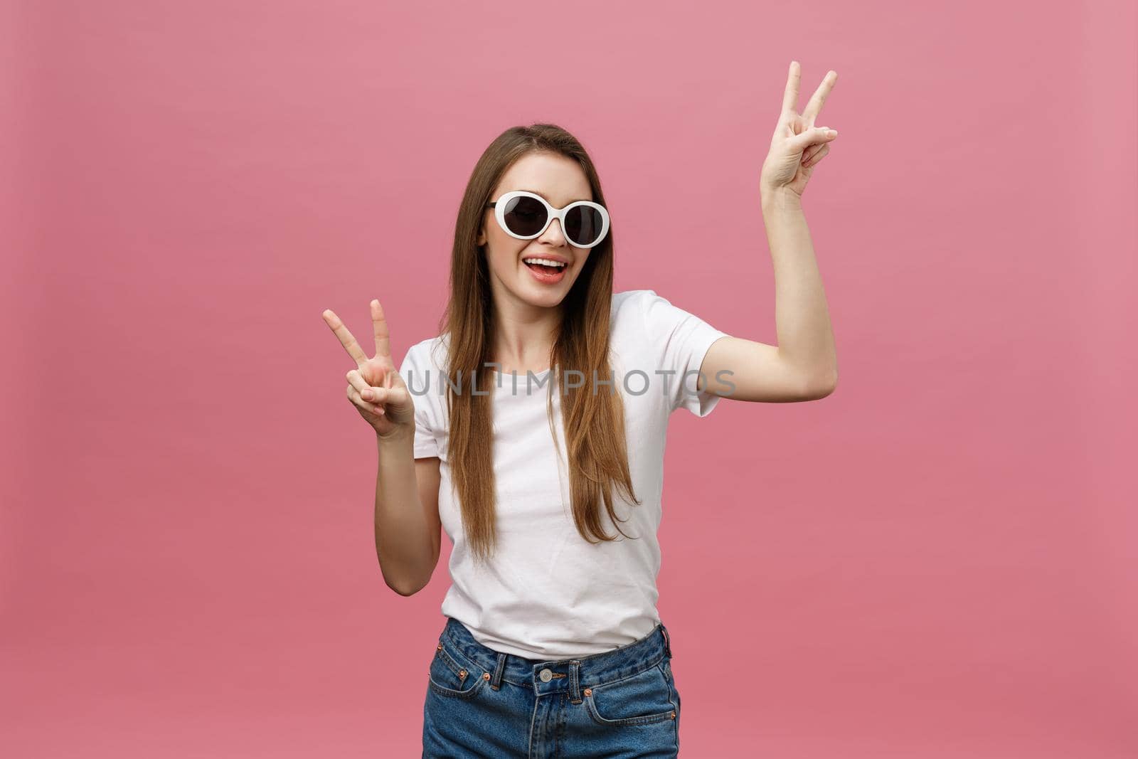 Young caucasian woman over isolated background smiling looking to the camera showing fingers doing victory sign. Number two by Benzoix