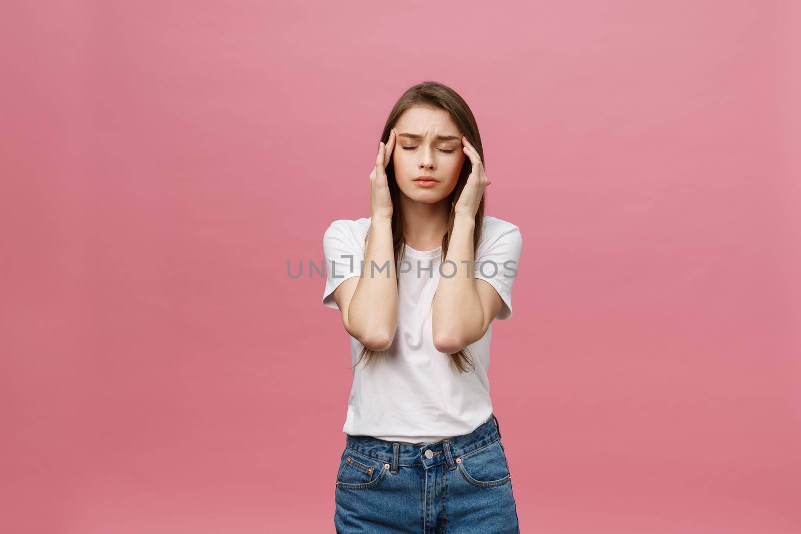 girl suffers from terrible headaches and compresses the head with fingers. Forget and remember something, suffer from illness.