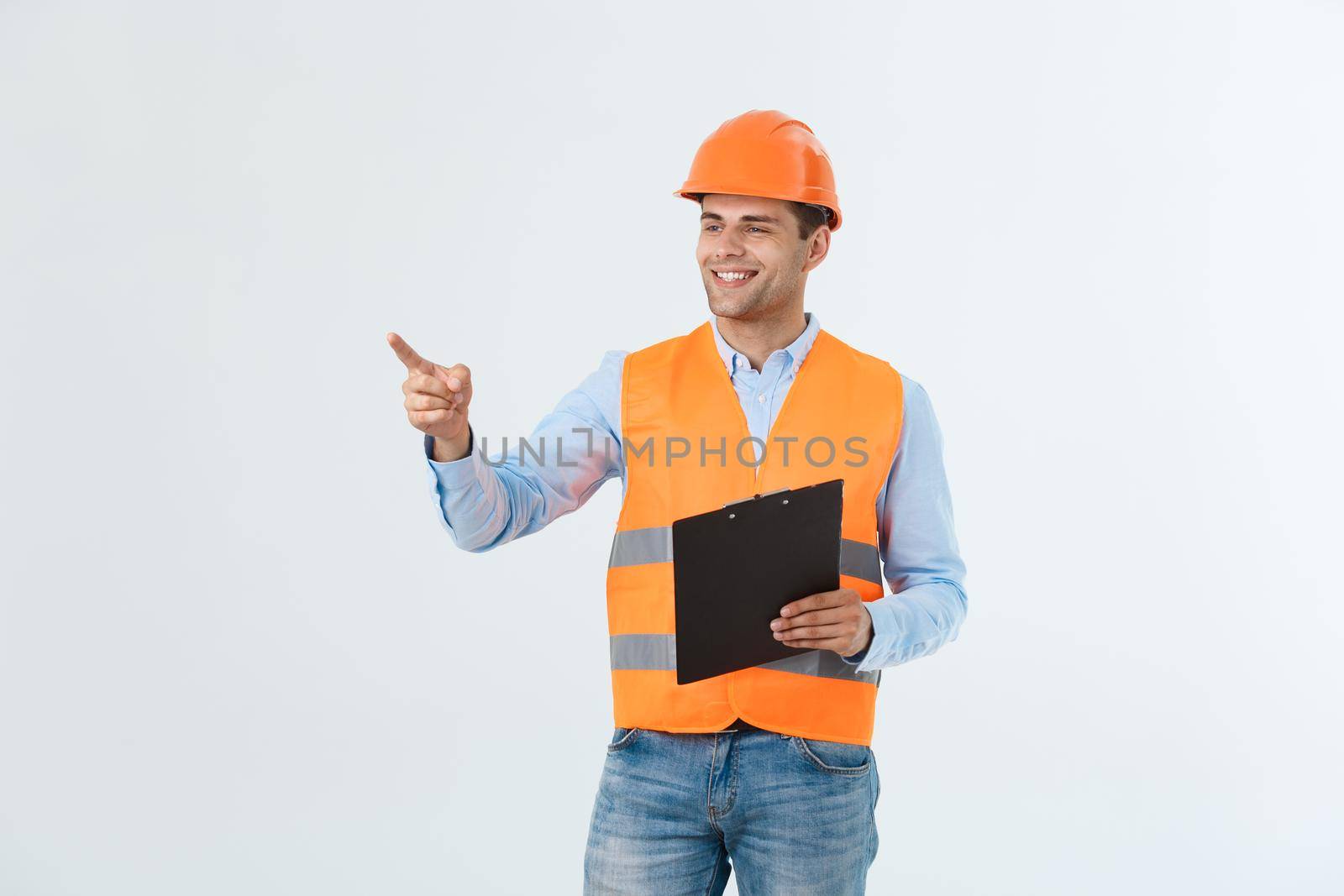 Engineers examining documents on clipboard isolated over white background. by Benzoix