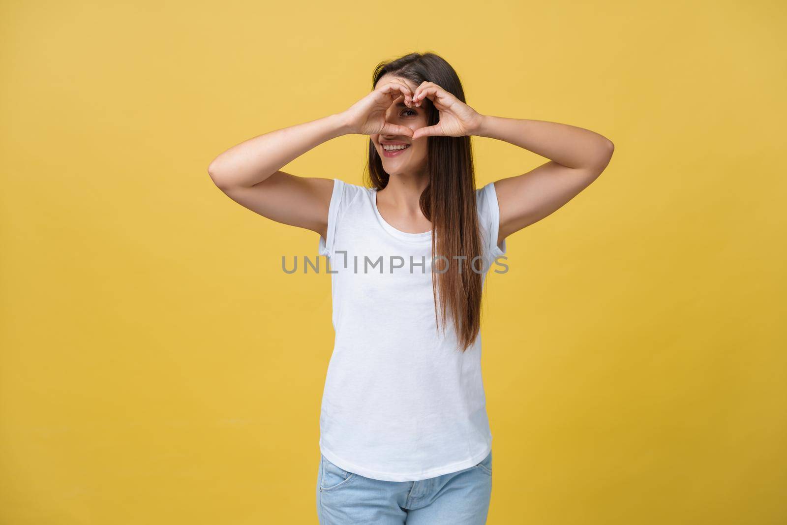 Healthy Eyes And Vision. Portrait Of Beautiful Happy Woman Holding Heart Shaped Hands Near Eyes. Closeup Of Smiling Girl With Healthy Skin Showing Love Sign. Eyecare. High Resolution Image. by Benzoix