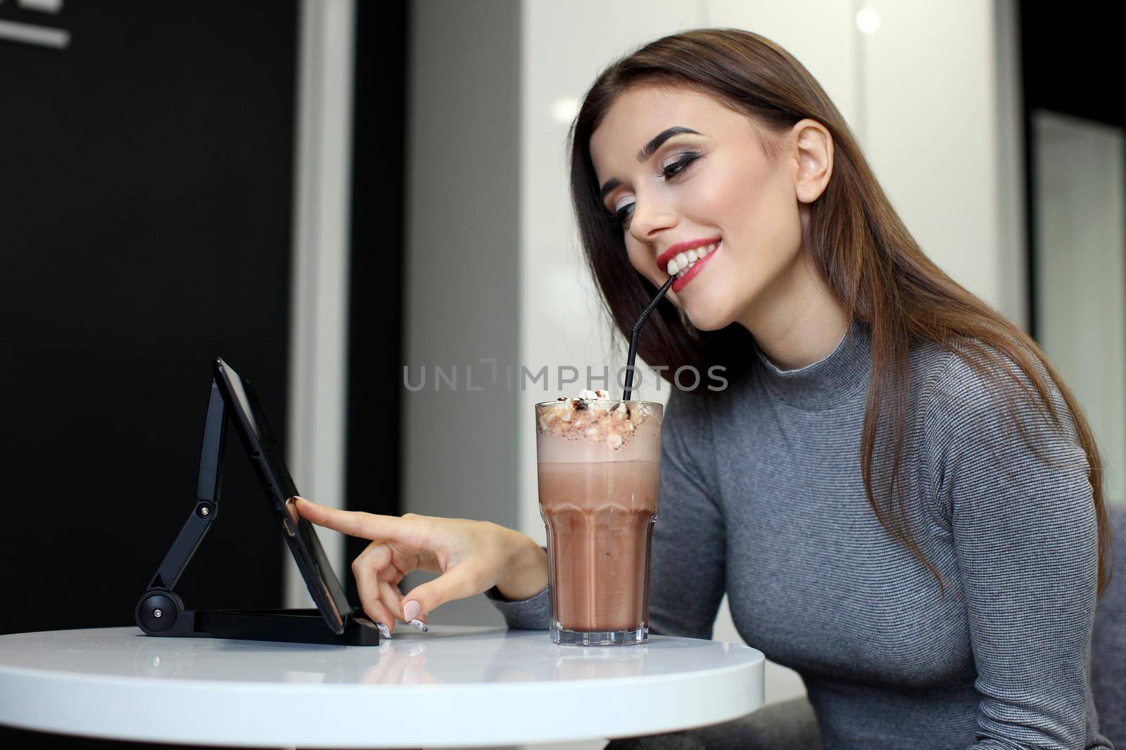 Smiling Woman with Coffee Frappe Drink at the Restaurant - Portrait of a beautiful girl with frappuccino