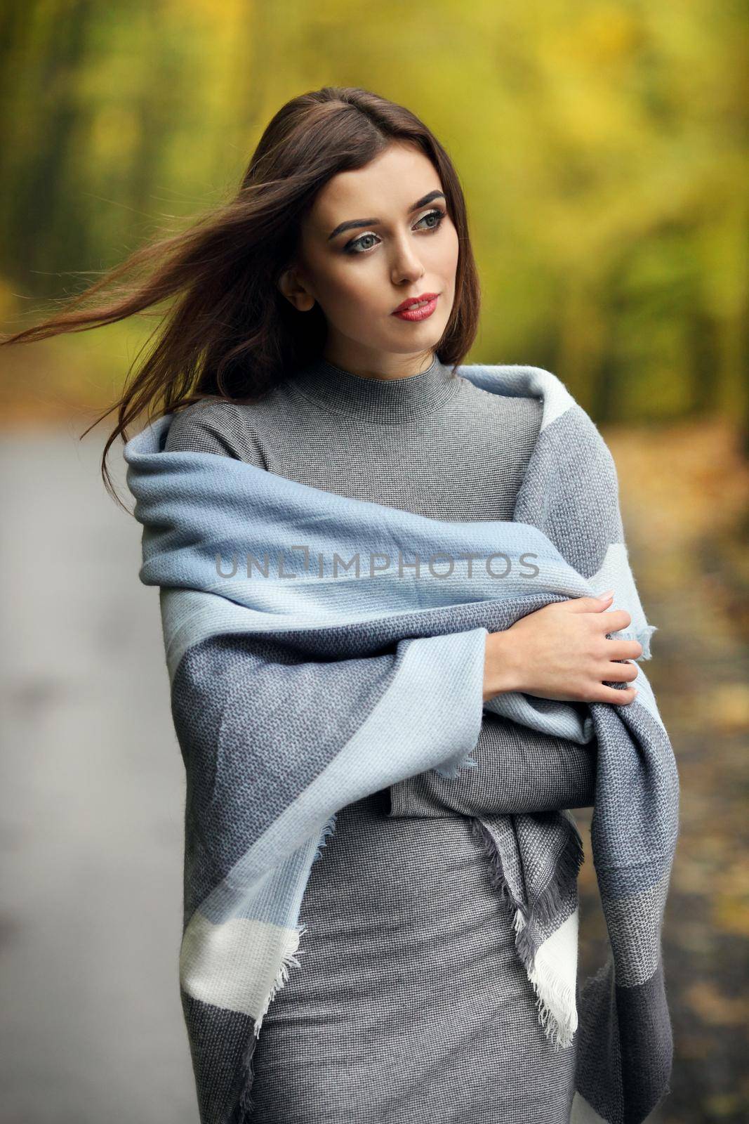 Autumn woman portrait smiling outdoors at the park