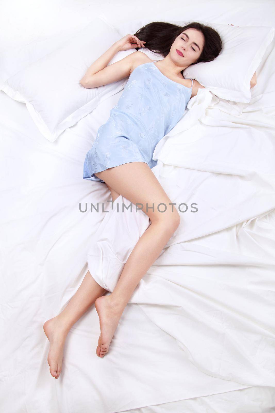 lonely woman in bed missing her partner overhead view of sleeping beauty