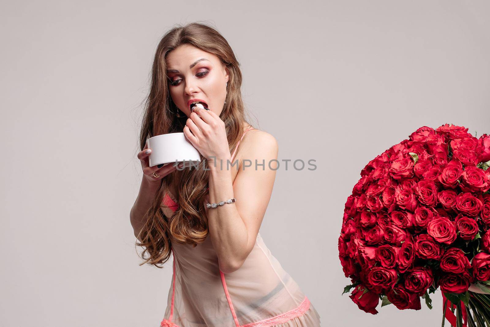 Funny woman eating sweets and running away from bouquet by StudioLucky
