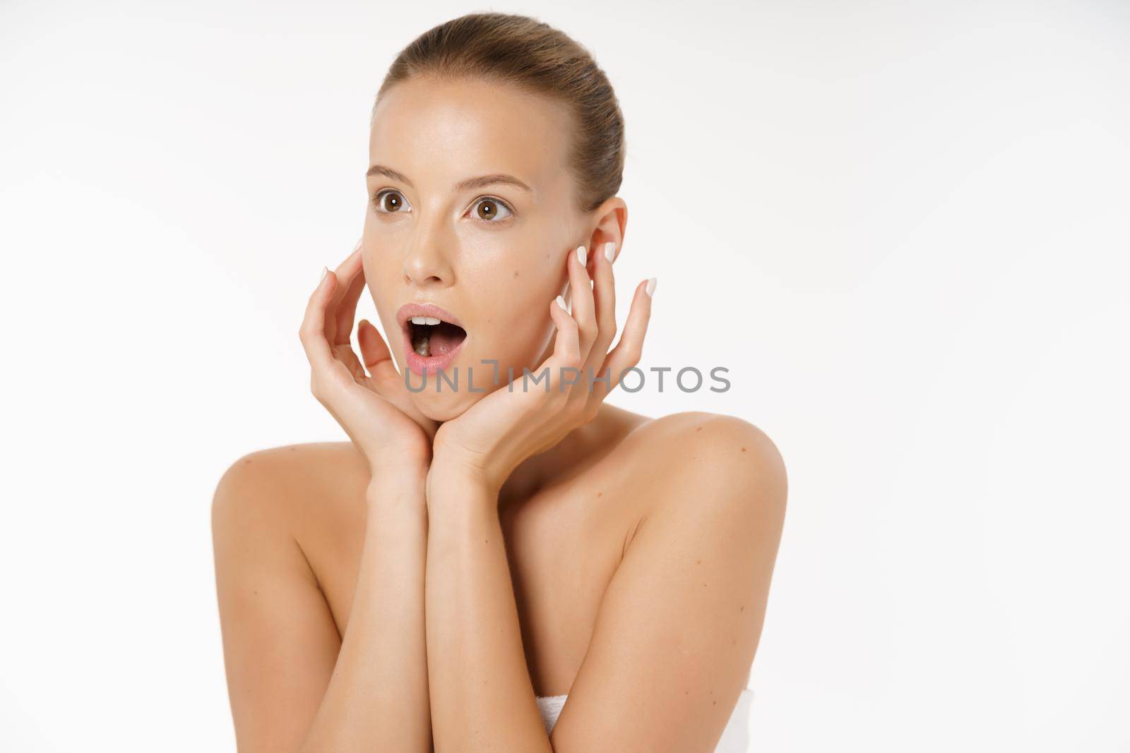 Close-up Of Worried Woman Looking At Pimple On Face.