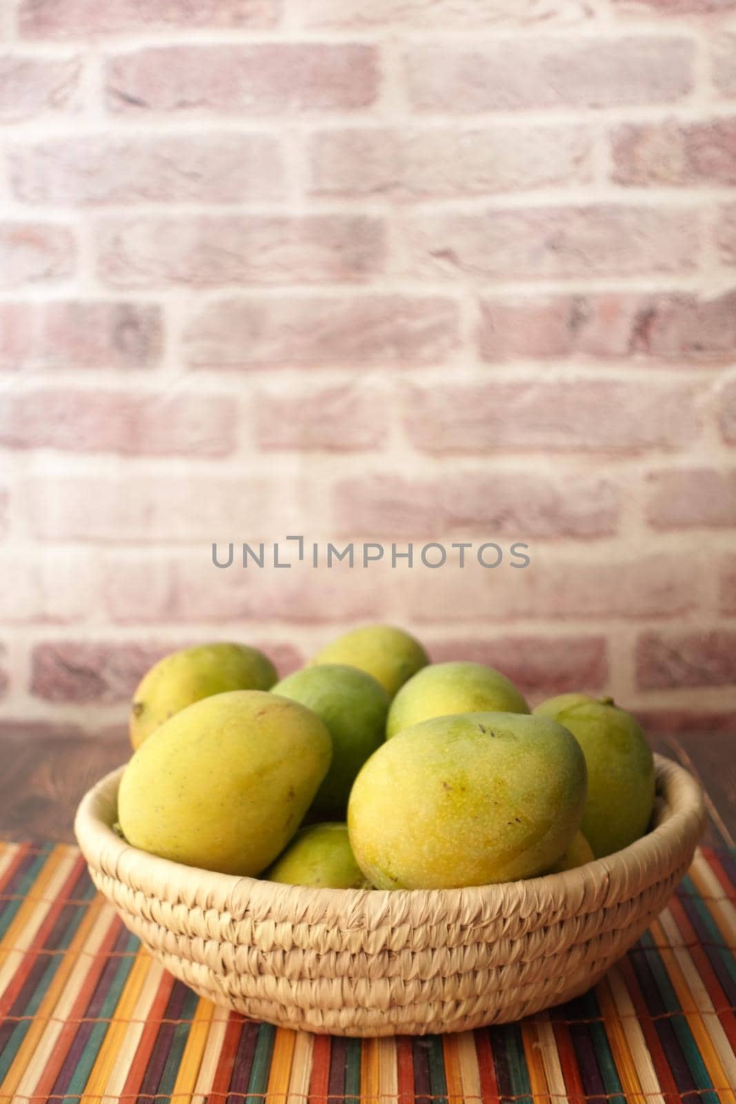 Close up of fresh apple in a bowl on wooden table.