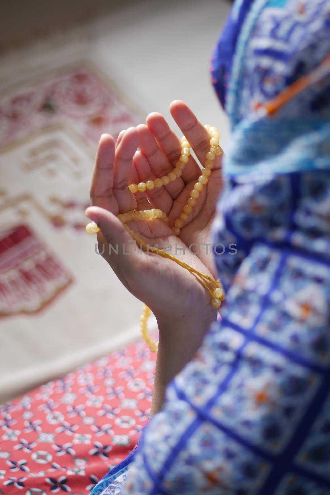 Close up of muslim women hand praying at ramadan .