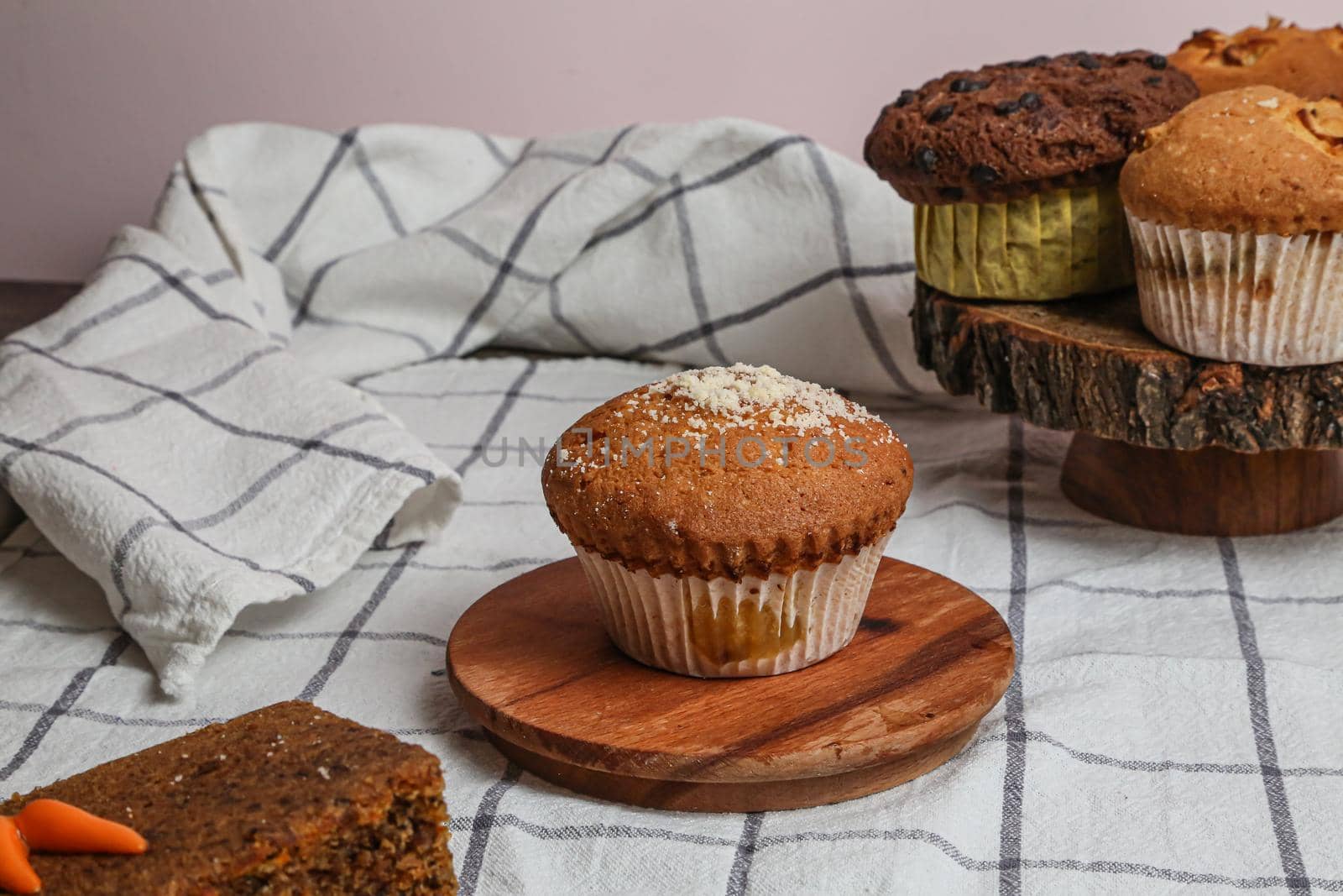 Chocolate muffin and walnut muffin, homemade bakery on dark background