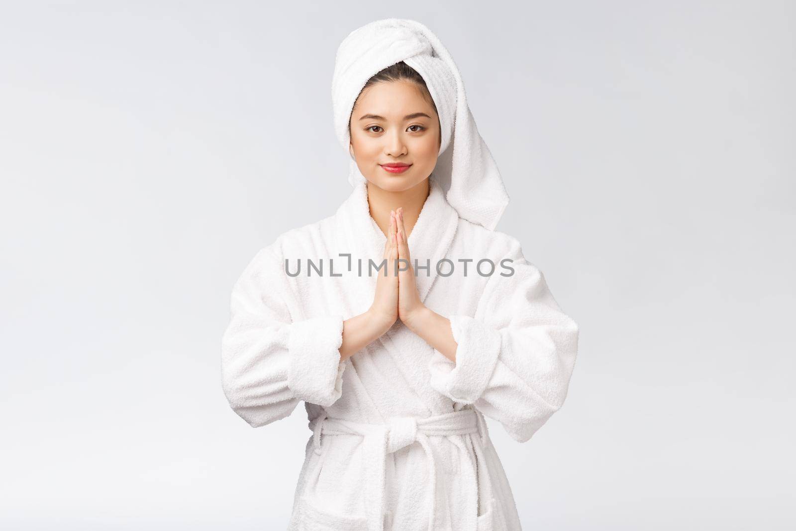 Beautiful women take care of skin health holding hand praying. Beautiful girl on white background