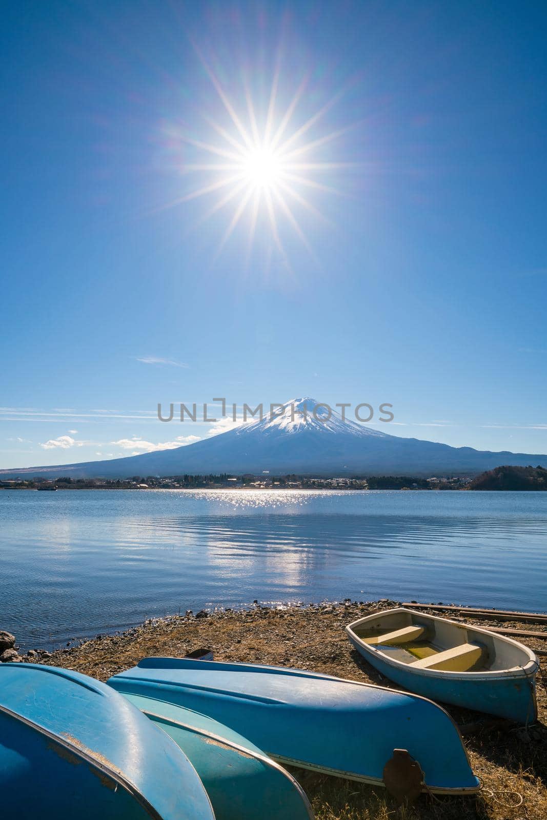 Sun star effect shot with Mountain Fuji and boats  by f11photo