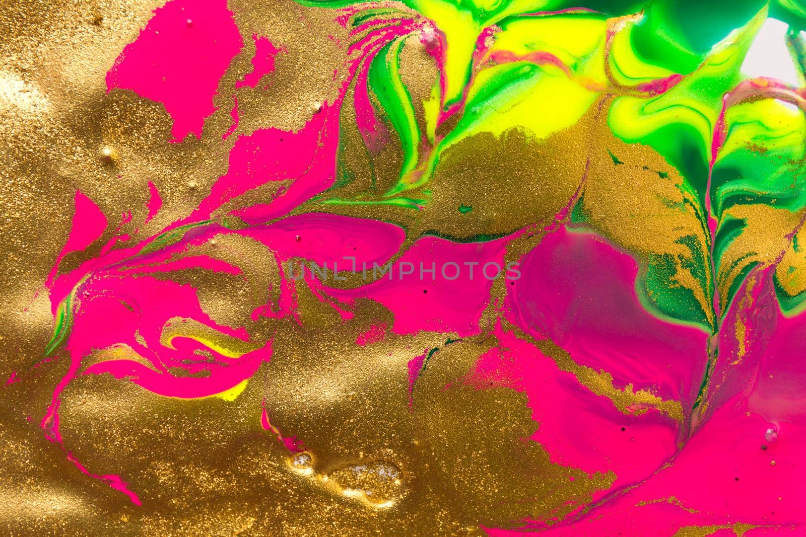 Gold foil abstract background with fluorescent pink parts.