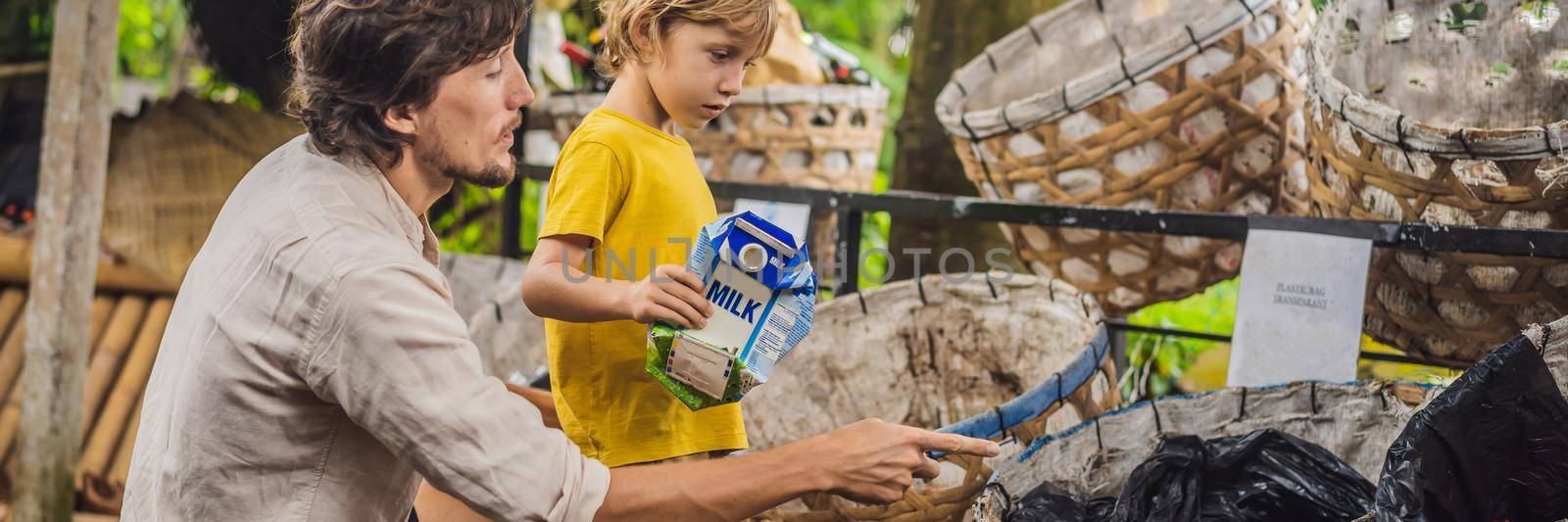Dad and son, separate garbage collection. Teaching children to separate garbage collection. BANNER, LONG FORMAT