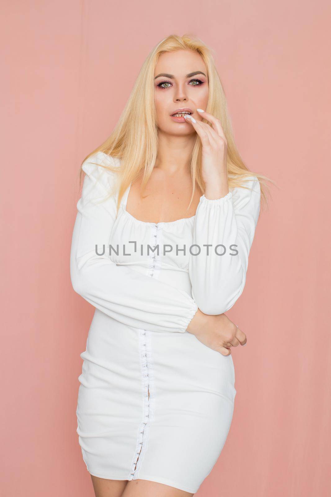 Woman in white dress with long sleeve by Bonda