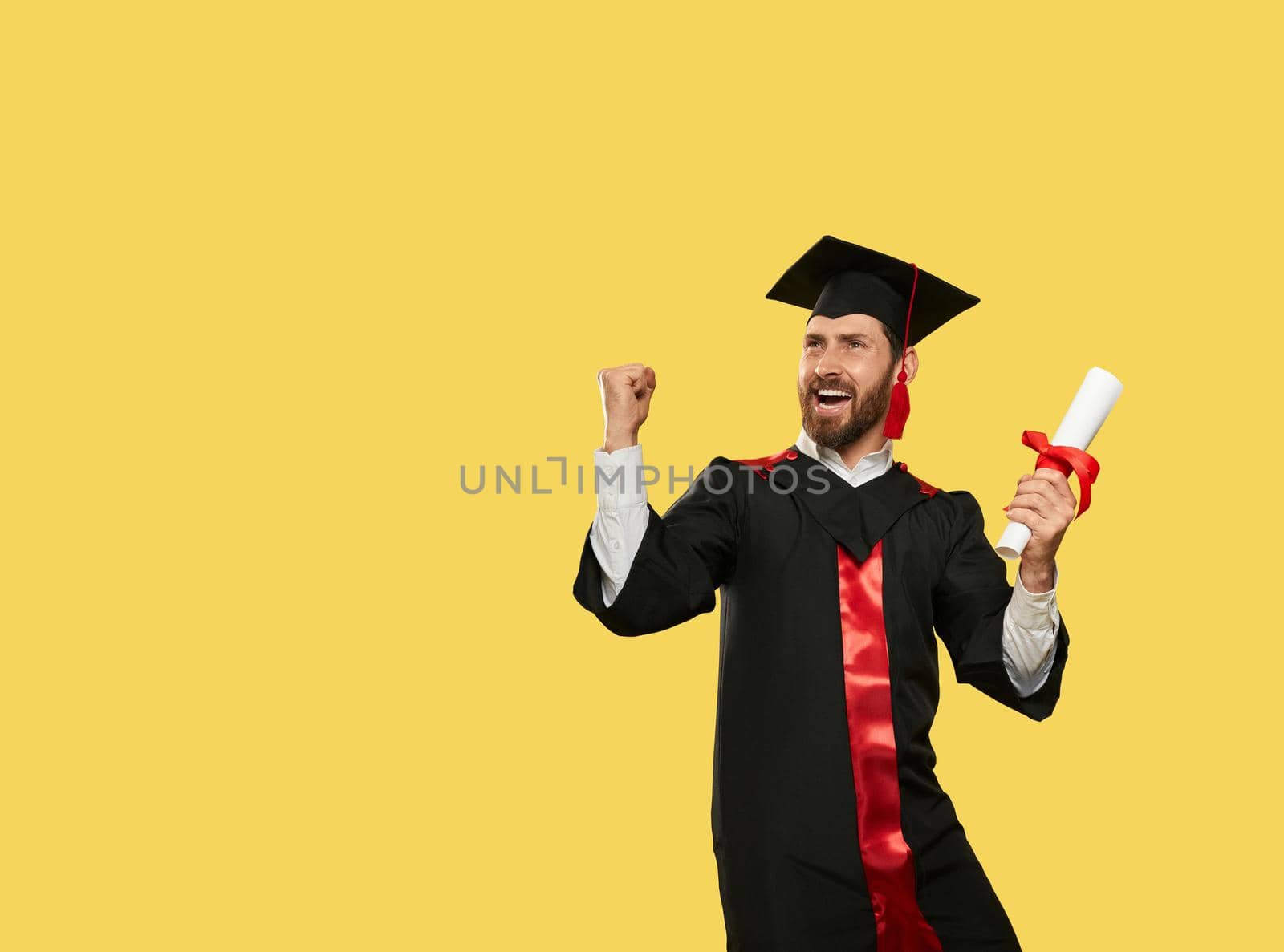 Male student graduating from univeristy, college. by SerhiiBobyk