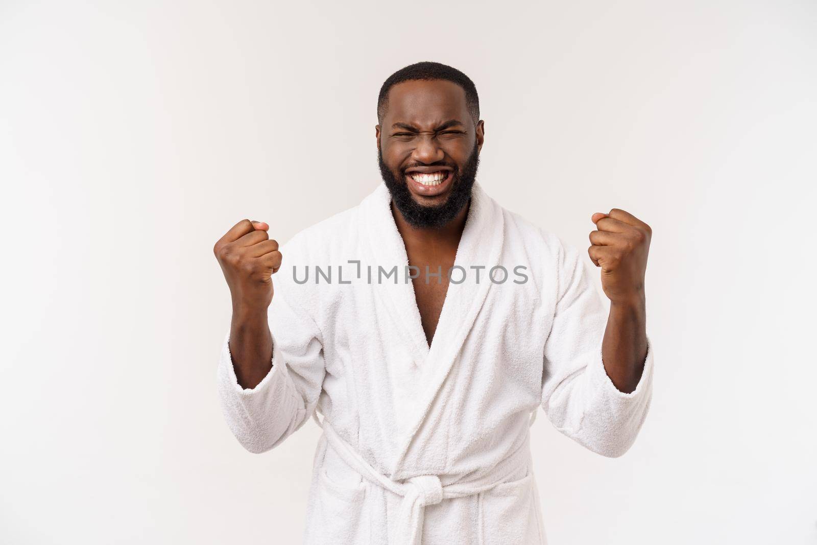 Young african american man wearing bathrobe over isolated white background thinking looking tired and bored with depression problems