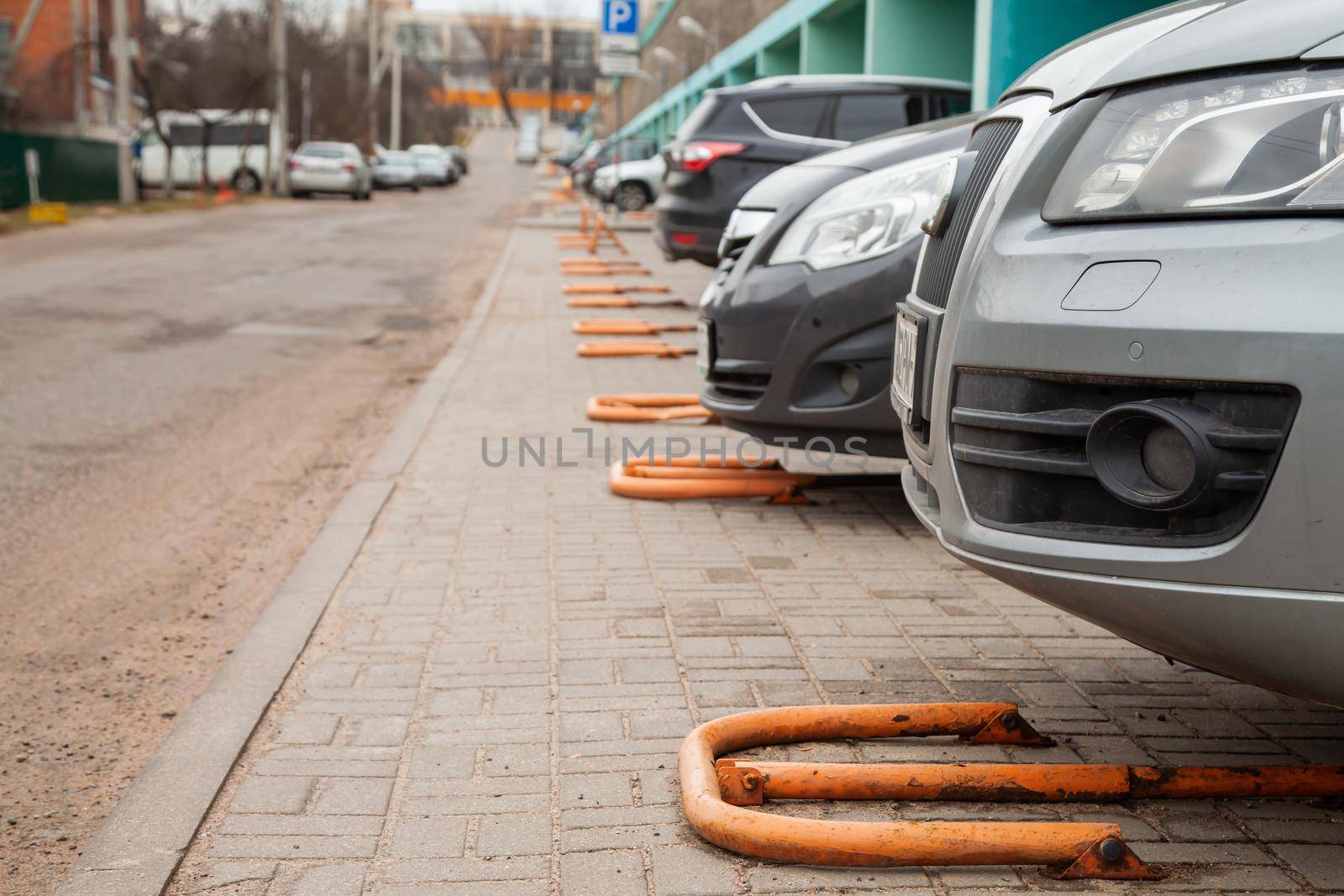 Cars are on private individual packaging. Private yellow metal lock in private parking