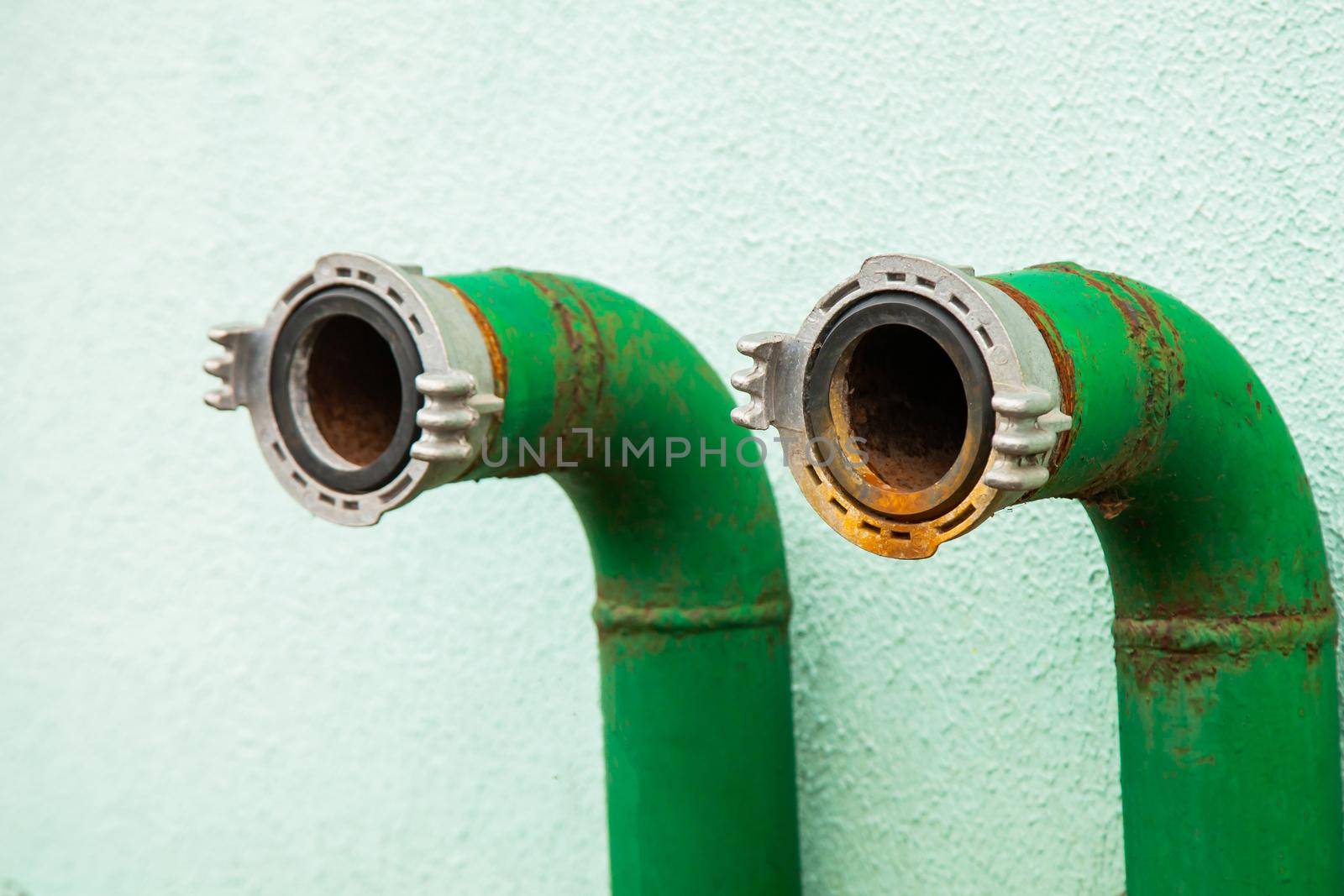 Fire hydrant nozzle green, close-up hose connection