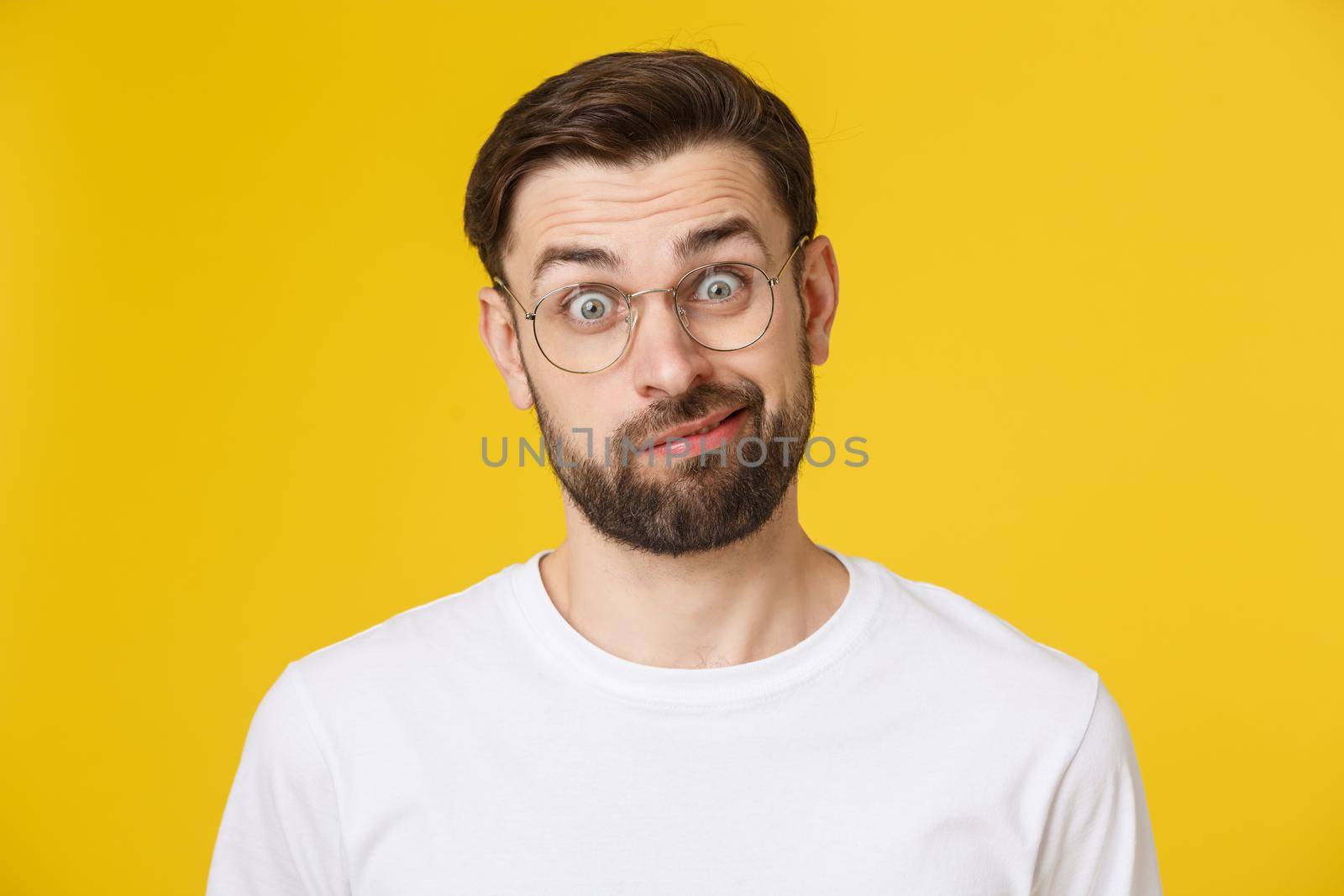 Young casual man portrait isolated on yellow background by Benzoix