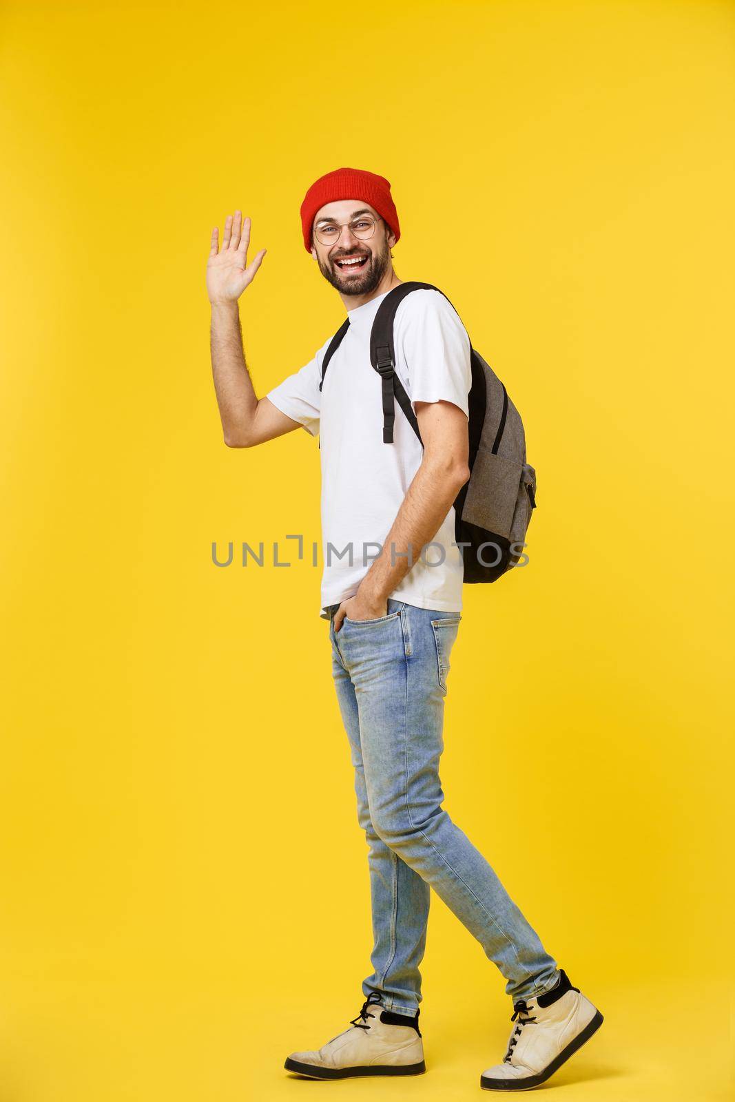 young hipster man wearing hat , suspenders, isolate on yellow background. by Benzoix