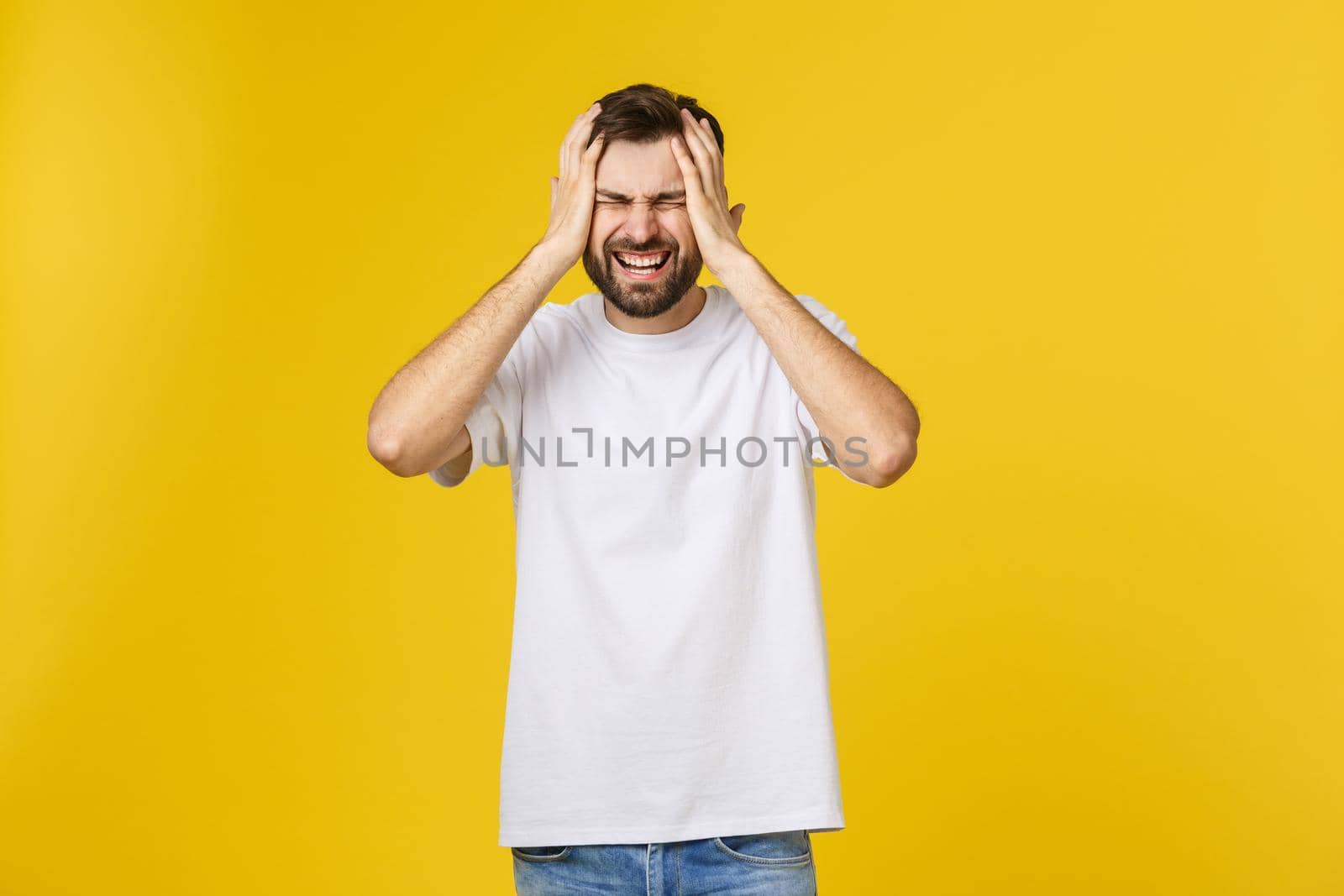 Adult hispanic man over isolated background depressed and worry for distress, angry and afraid. Sad expression.