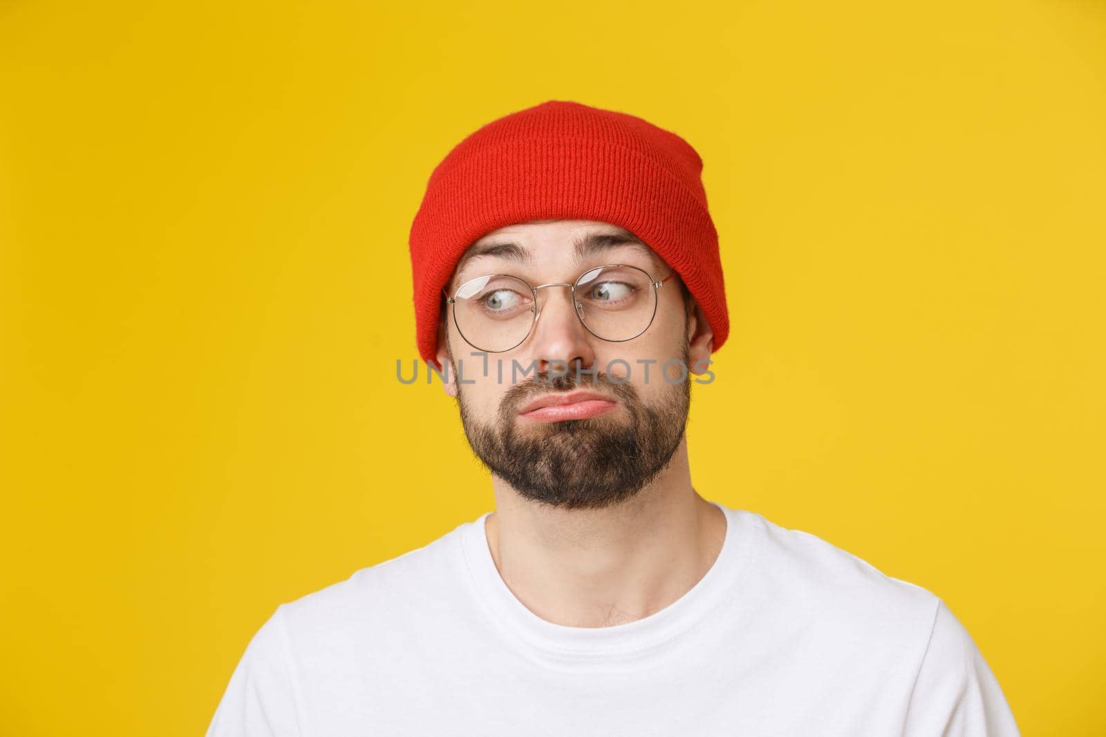 Adult hispanic man over isolated background depressed and worry for distress, angry and afraid. Sad expression.