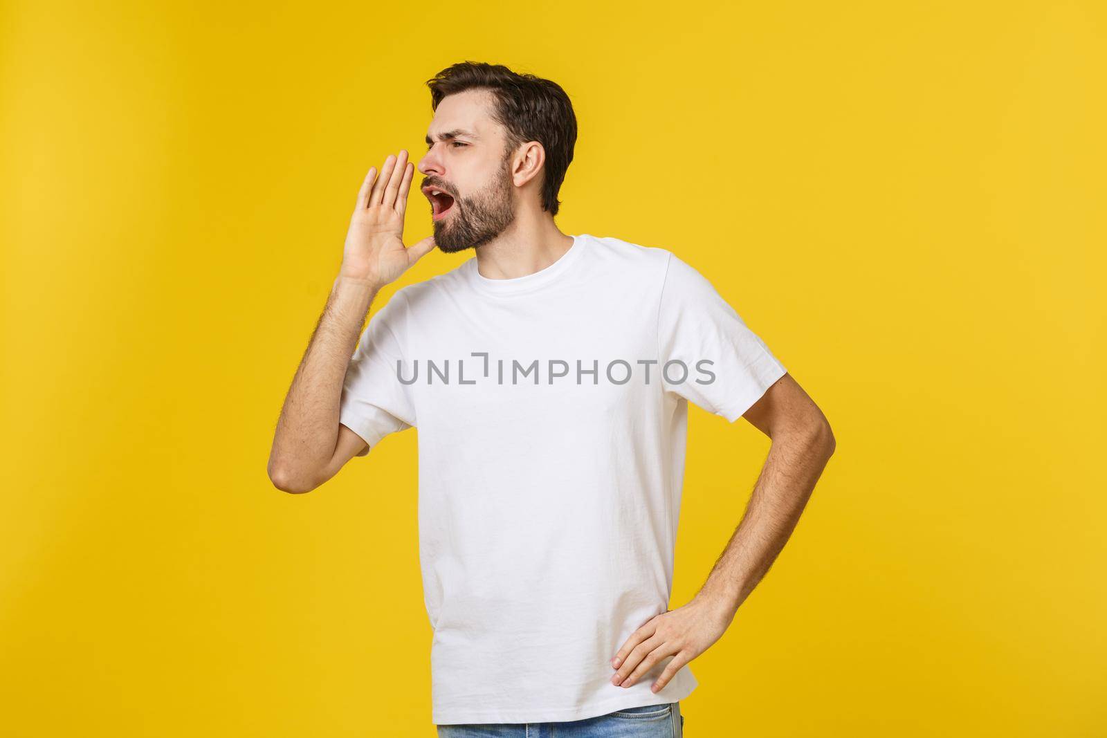 Portrait of a young man shouting loud with hands on the mouth. by Benzoix