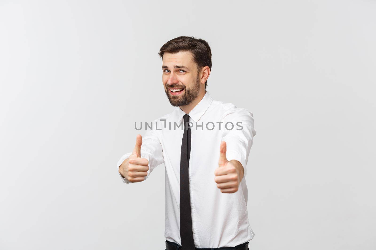 Happy smiling young business man with thumbs up gesture, isolated over white background.