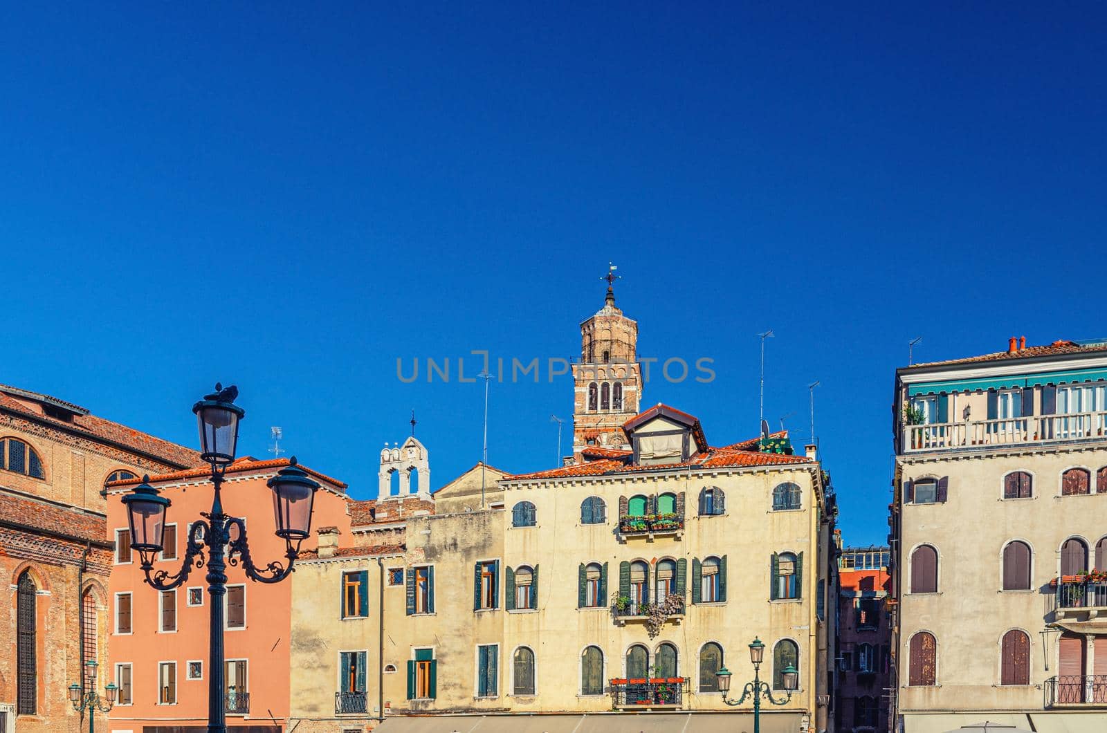 Campo Santo Stefano square with typical italian buildings of Venetian architecture and Santo Stefano Bell Tower in Venice historical city centre San Marco sestiere, Veneto region, Northern Italy