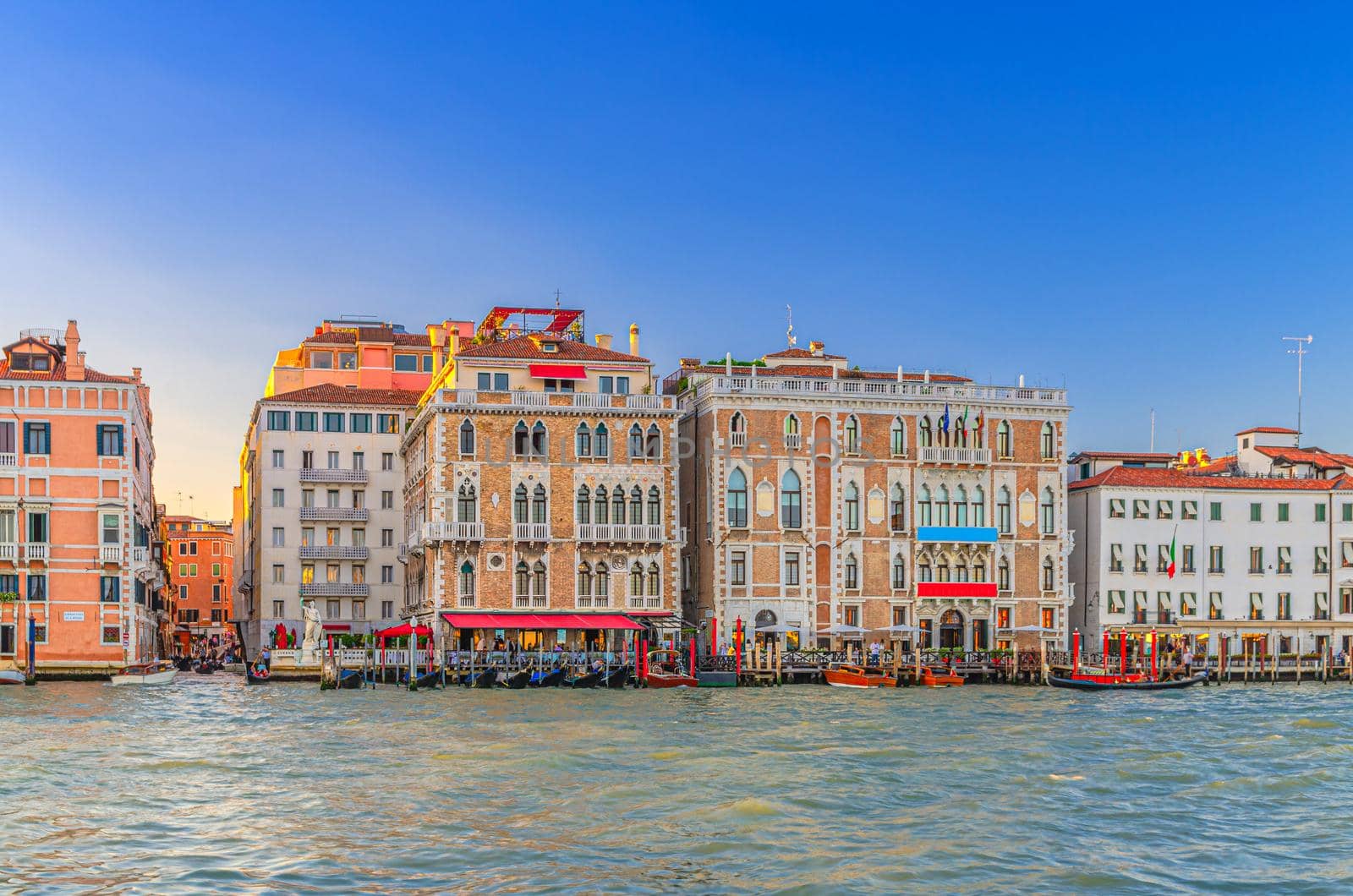 Ca Giustinian palace or Palazzo Giustinian building in San Marco sestiere on Grand Canal waterway in Venice historical city centre, blue clear sky background in the evening, Veneto Region, Italy