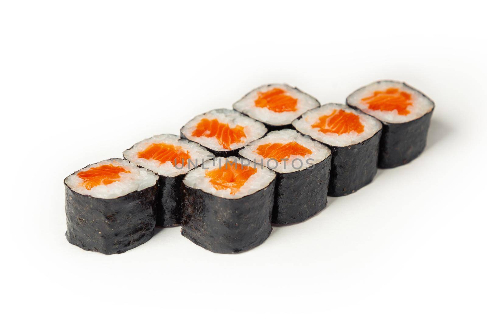Sushi maki on a white plate. Sushi roll maki with salmon red fish. For the restaurant menu. Close-up.