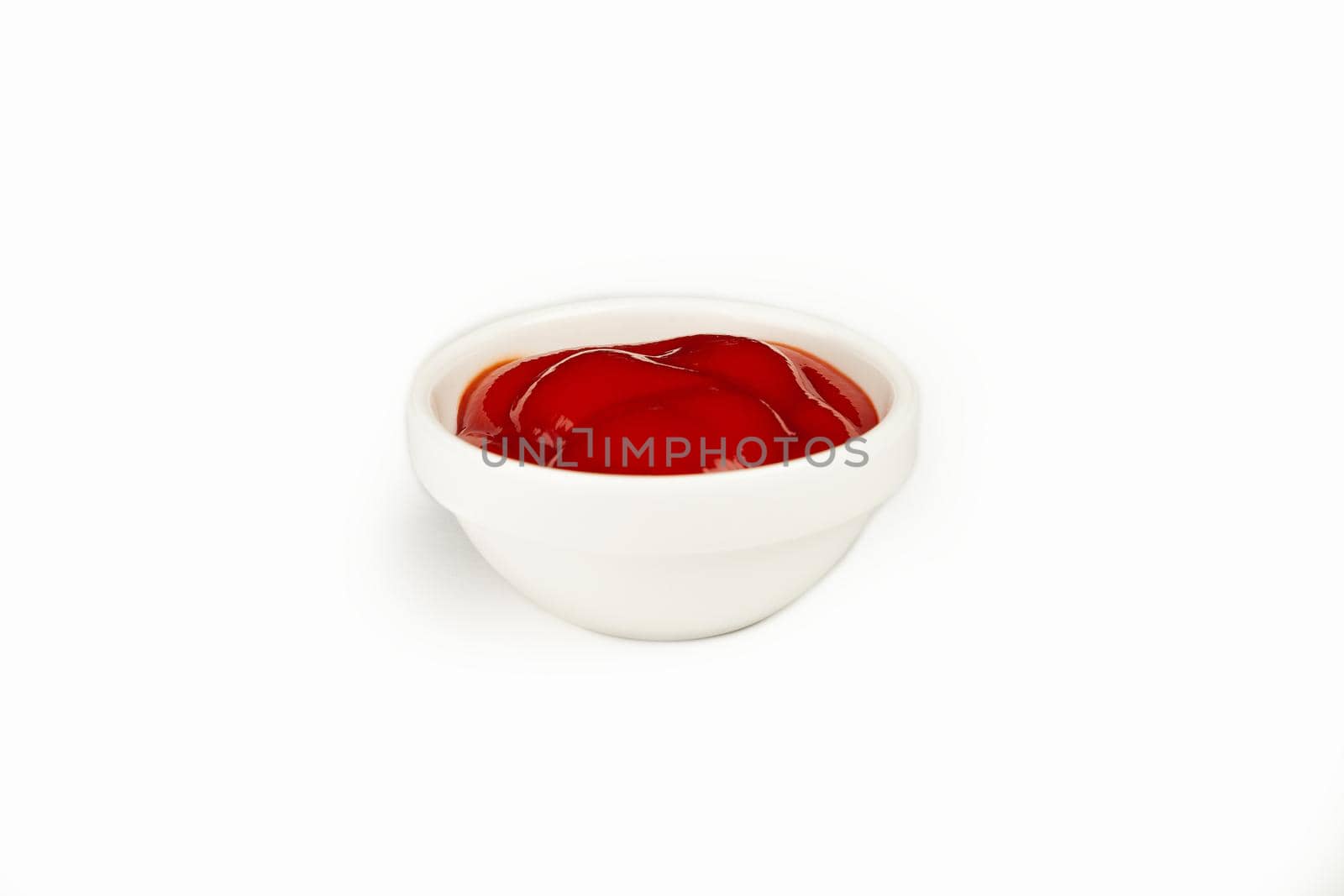 Red delicious ketchup or tomato sauce in a bowl on a white background. For the restaurant menu. Traditional Japanese sushi seasoning. Healthy eating