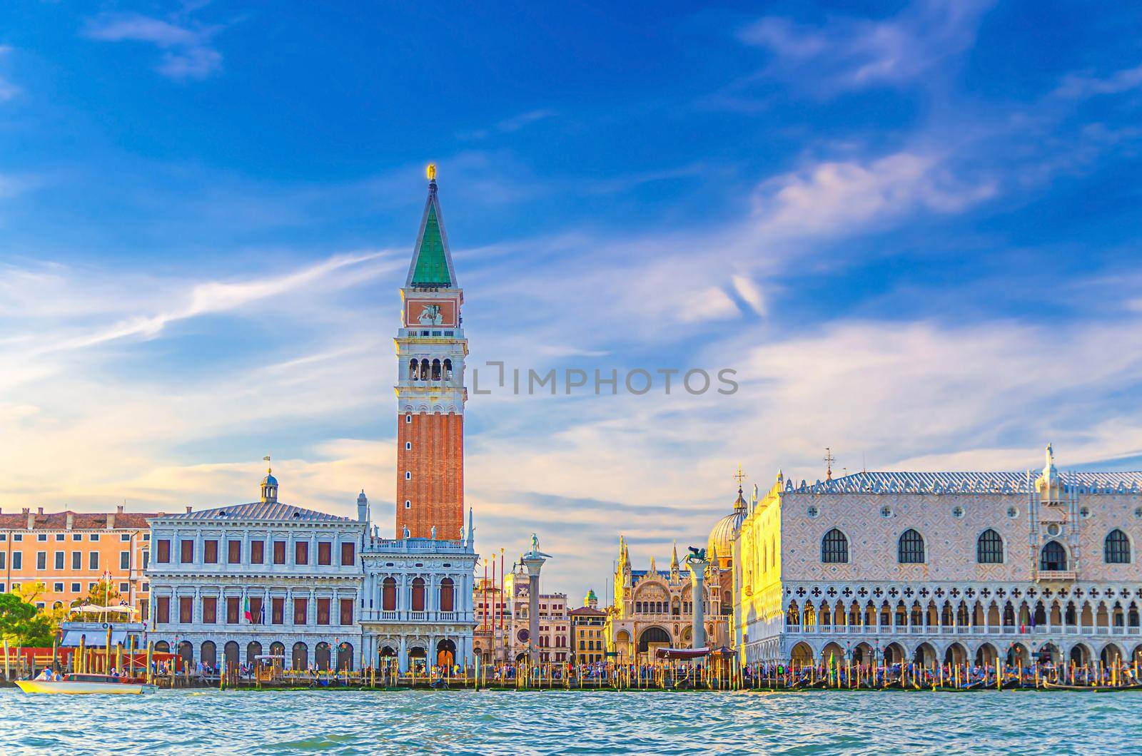 Venice cityscape with San Marco basin of Venetian lagoon water, Riva degli Schiavoni waterfront promenade, Doge's Palace Palazzo Ducale and Campanile bell tower building, Veneto Region, Italy